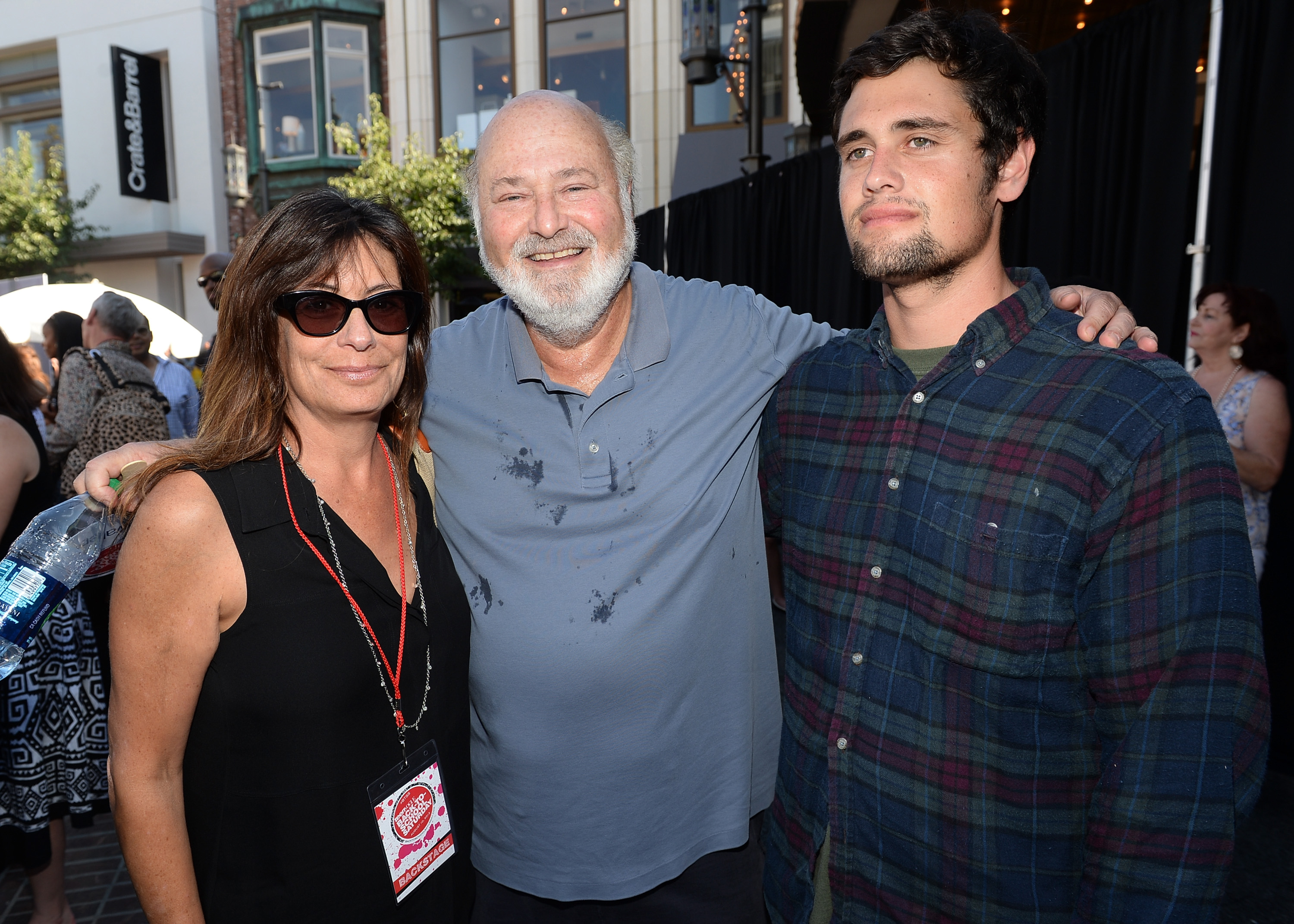 Michele Singer Reiner and Rob Reiner with their son, Nick Reiner, at Teen Vogue's Back-to-School Saturday kick-off event in Los Angeles, California on August 9, 2013. | Source: Getty Images