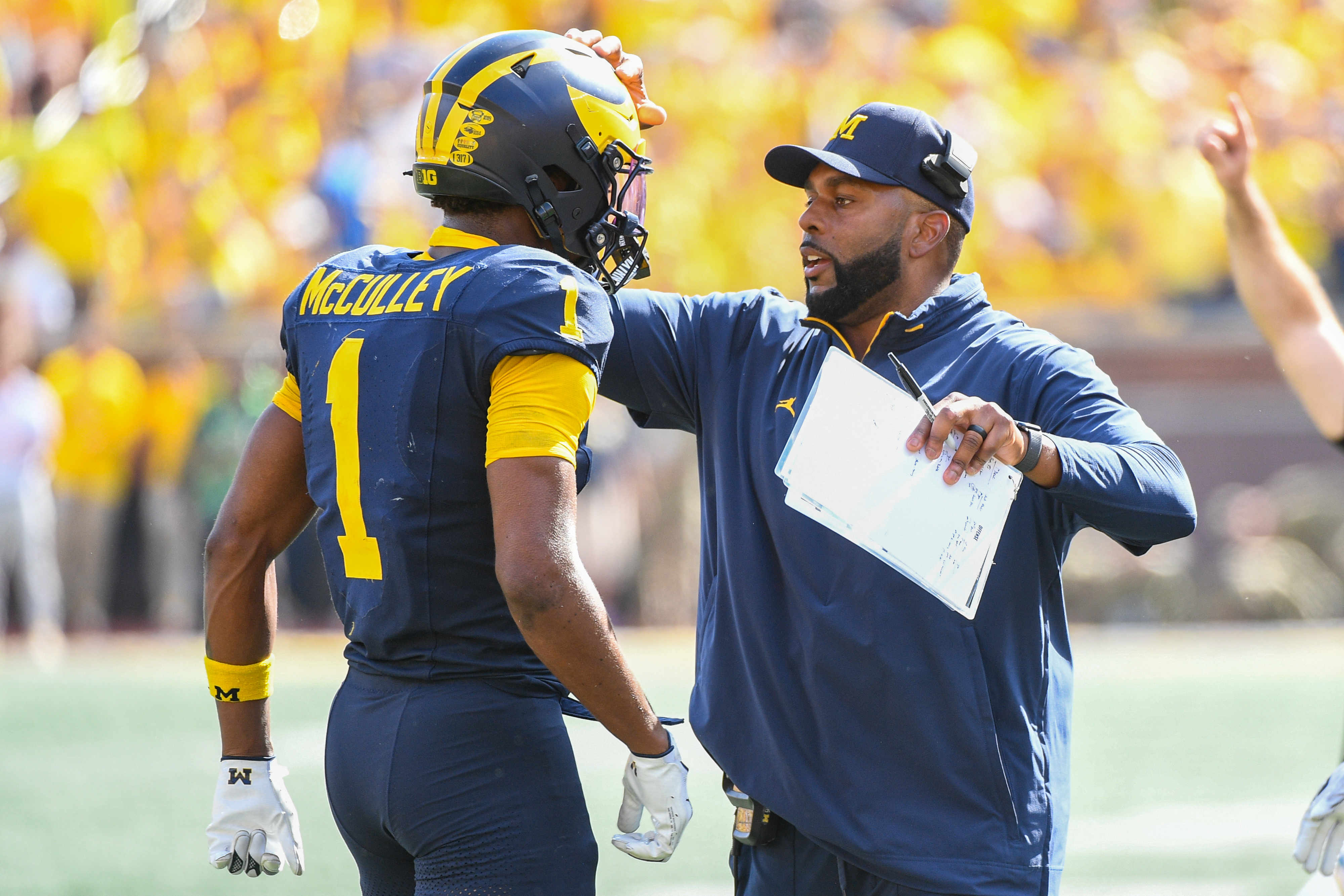Sherrone Moore celebrates with Donavan McCulley #1 of the Michigan Wolverines after a touchdown during the second half of a college football game against the Wisconsin Badgers on October 4, 2025 | Source: Getty Images