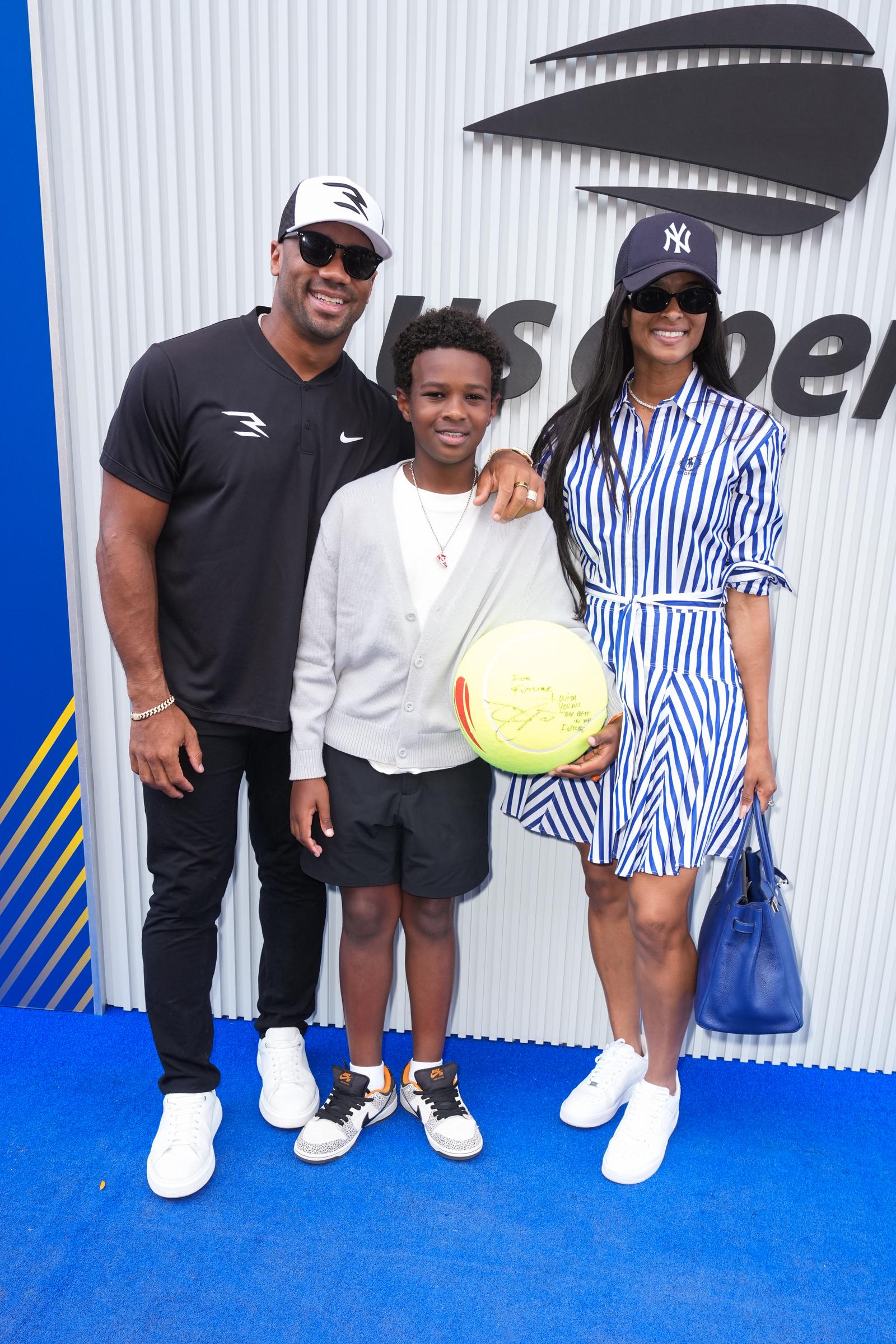Russell Wilson, 36, Future Zahir Wilburn, 11, and Ciara, 39, attend the US Open Tennis Championship at the USTA Billie Jean King National Tennis Center on August 31, 2025, in New York City.