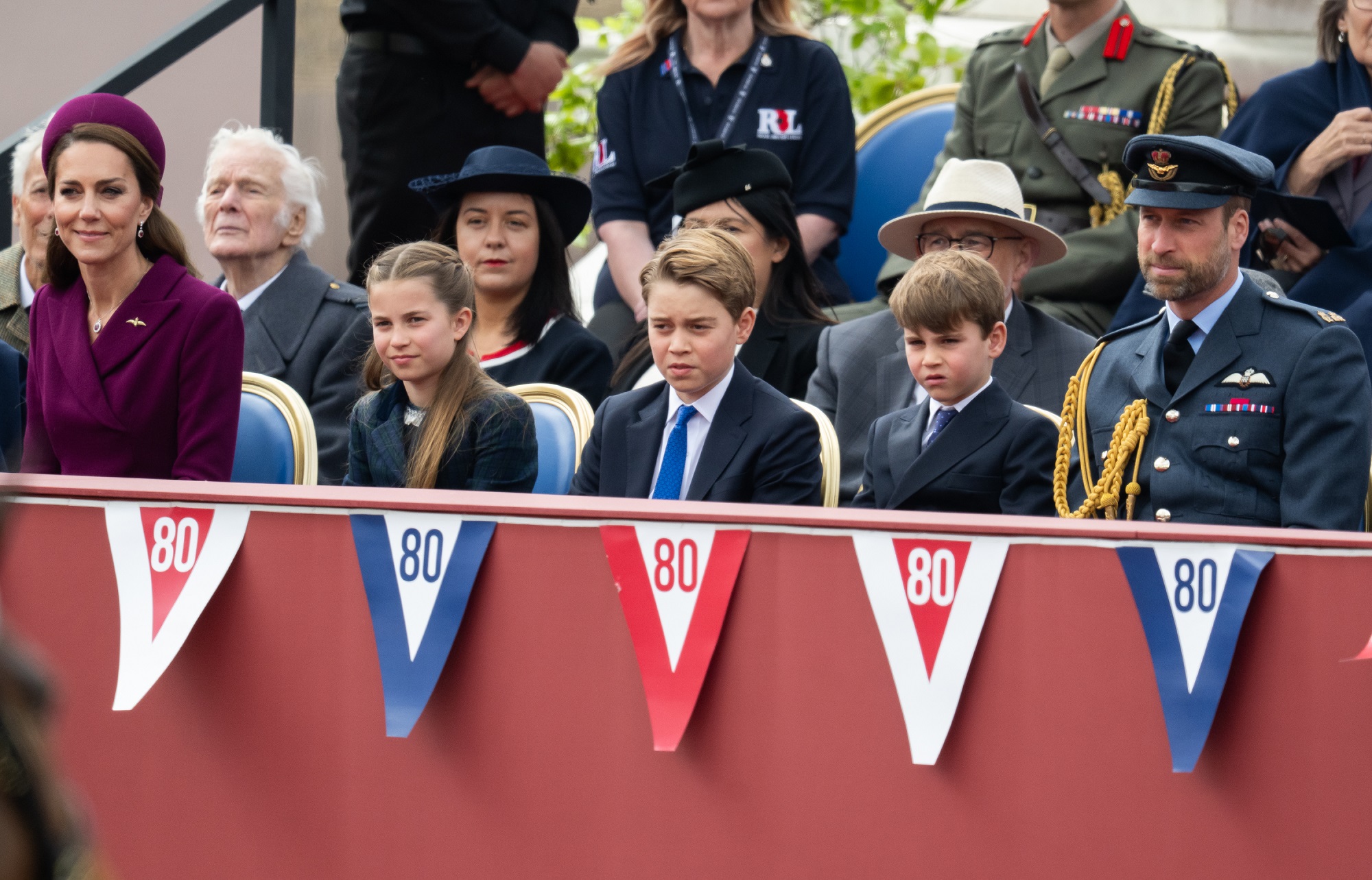 Catherine, Princess of Wales, sits alongside Princess Charlotte, Prince George, Prince Louis, and Prince William, Prince of Wales, during a military procession marking the 80th anniversary of VE Day on May 5, 2025, in London, England.