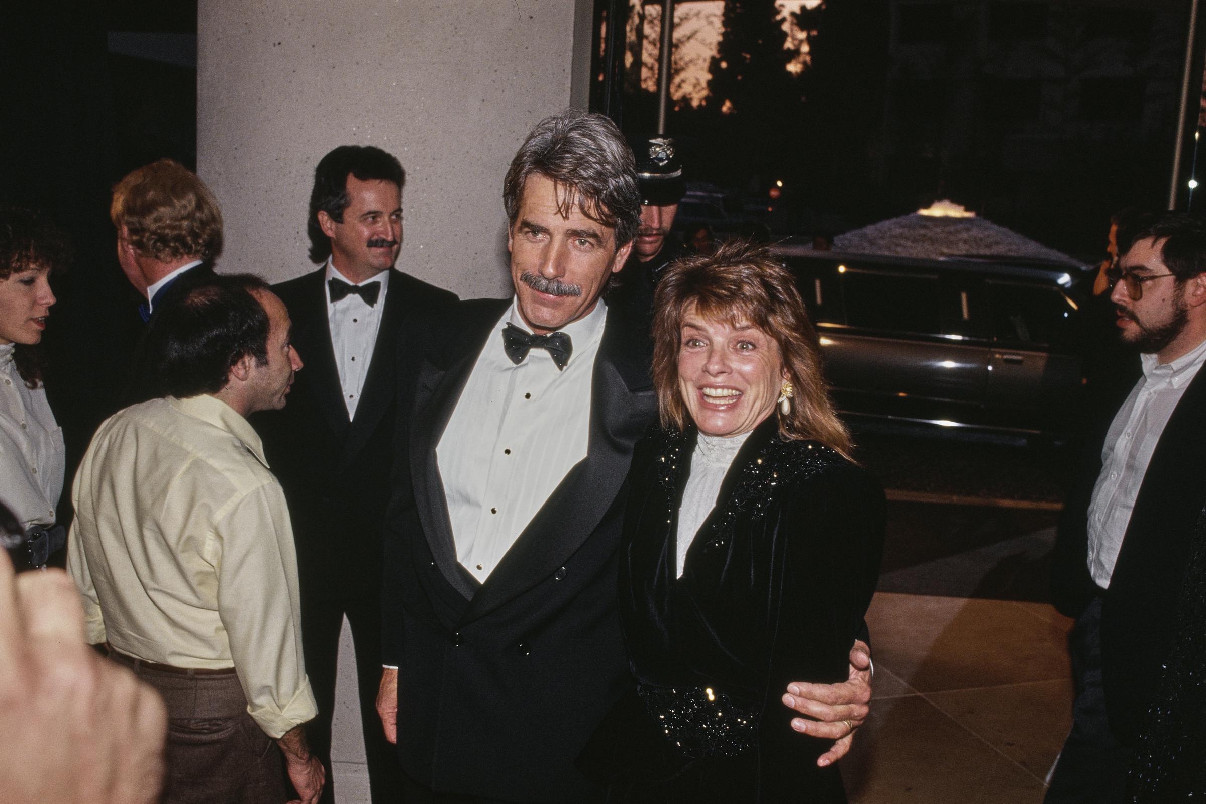 Dressed to impress for a star-studded evening, Sam Elliott and Katharine Ross arrived arm-in-arm at the 47th Annual Golden Globe Awards on January 20, 1990, in Beverly Hills, California. Katharine flashed an enthusiastic smile in a sparkling, sequin-embellished black jacket layered over a high-neck white blouse, while Sam looked distinguished beside her in a classic black tuxedo, white pleated shirt, and black bow tie. | Source: Getty Images