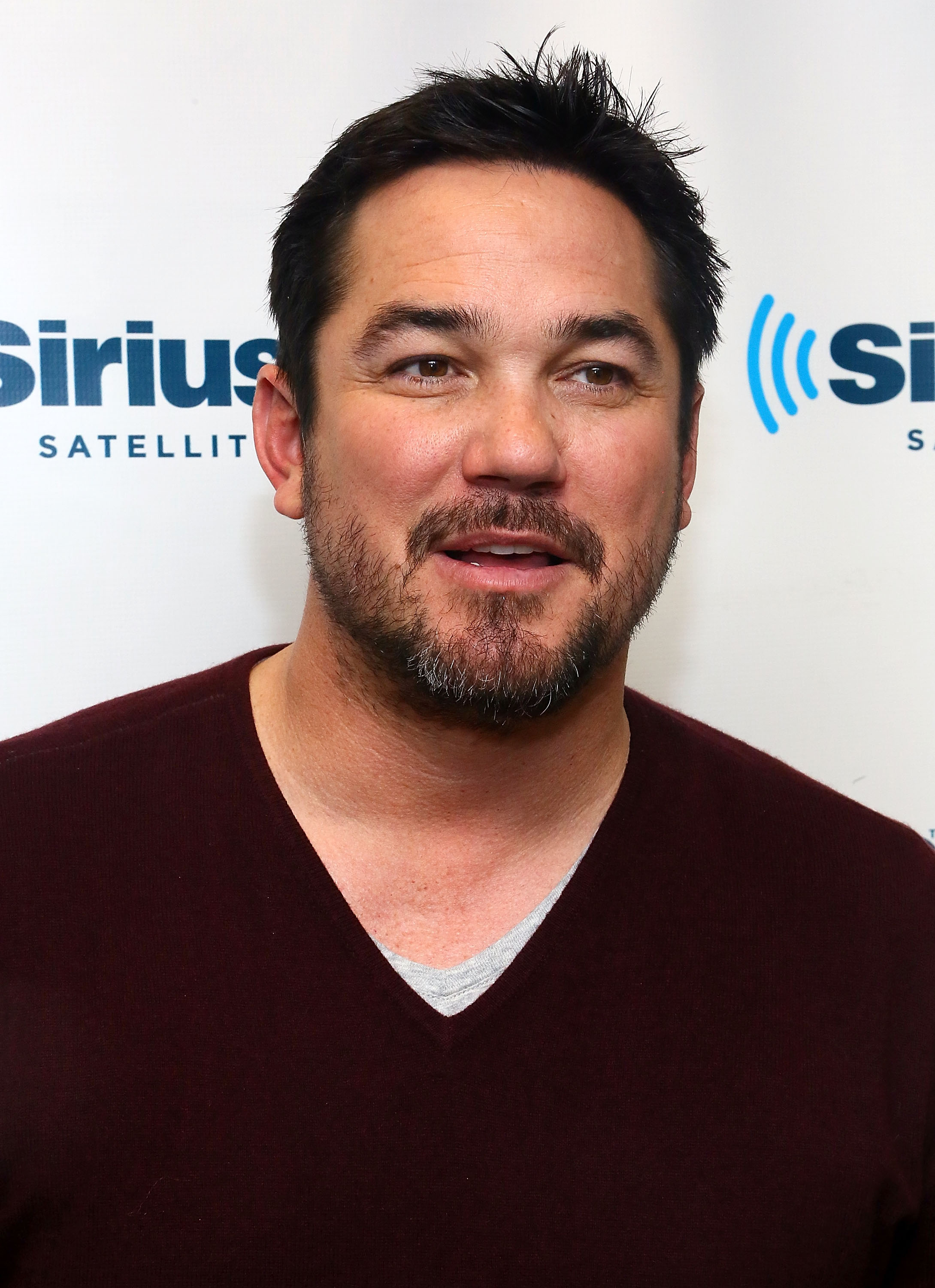 Dean Cain visited SiriusXM Studios in New York City in January 2014, three years after assuming sole custody of Christopher. Years later, Christopher would be photographed as an adult beside his father during a hospital stay. | Source: Getty Images