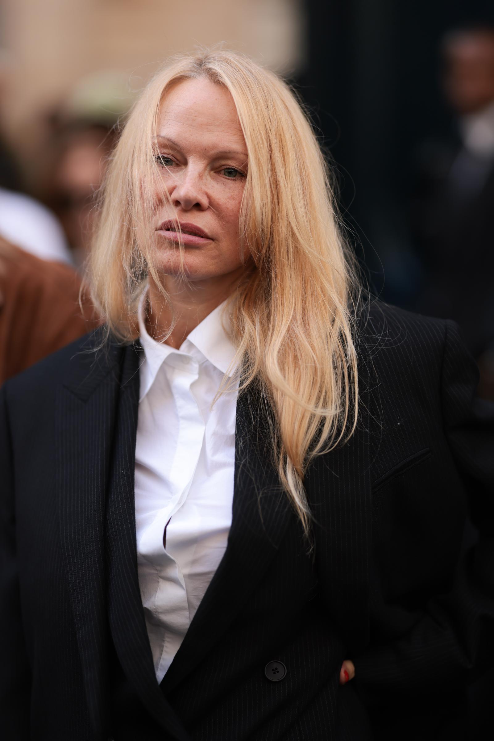 Pamela Anderson attends The Fashion Awards 2023 at London's Royal Albert Hall on December 5, 2023. Months after her makeup-free Paris Fashion Week appearances, she continued to embrace a pared-back beauty look on the red carpet. | Source: Getty Images