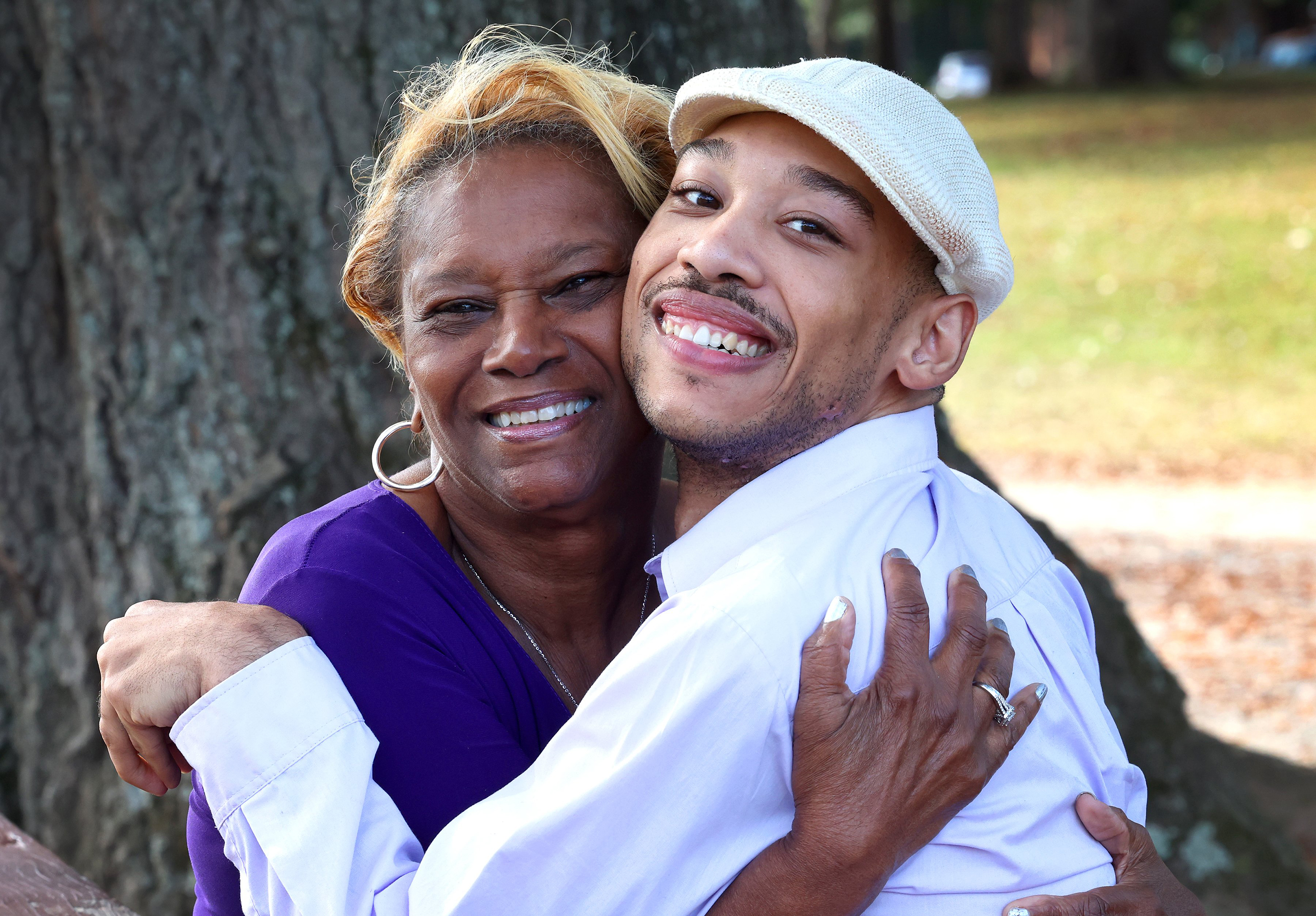 Beside him, Saundra Adams wrapped her arms around the grandson she raised as the pair shared a warm moment during the same October 30, 2024, interview at Freedom Park. Chancellor Lee Adams leaned into his grandmother as both smiled for the camera, capturing the close relationship they developed after Saundra became his full-time caregiver following the death of her daughter, Cherica Adams.