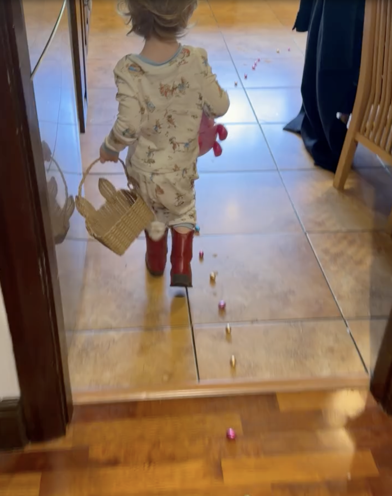 Sharon Osbourne's Easter surprise included a trail of chocolate eggs scattered through the house, which little Sidney followed in his pajamas and red boots, carrying a bunny-shaped basket. | Source: Instagram/@kellyosbourne
