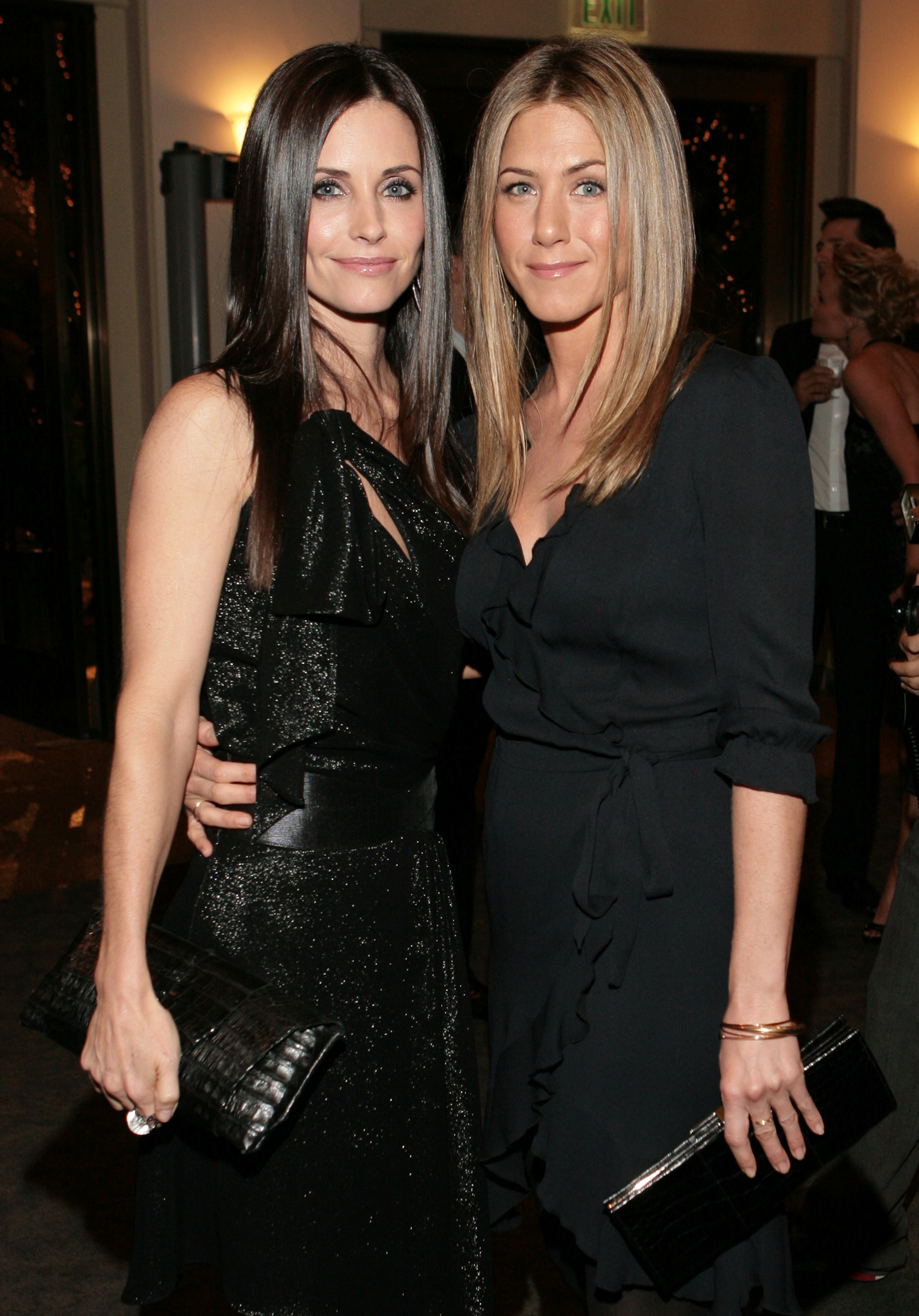 Courteney Cox and Jennifer Aniston at the "Dirt" Hollywood premiere arrivals and after party. The photo angle highlights the similar shape of their faces. Their facial appearance is enhanced by matching hairstyles with hair flowing down their cheeks and perfectly framing their features.