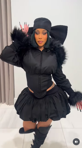 Cardi B lip syncing to her song "Hello," as she struts. | Source: Instagram/iamcardib