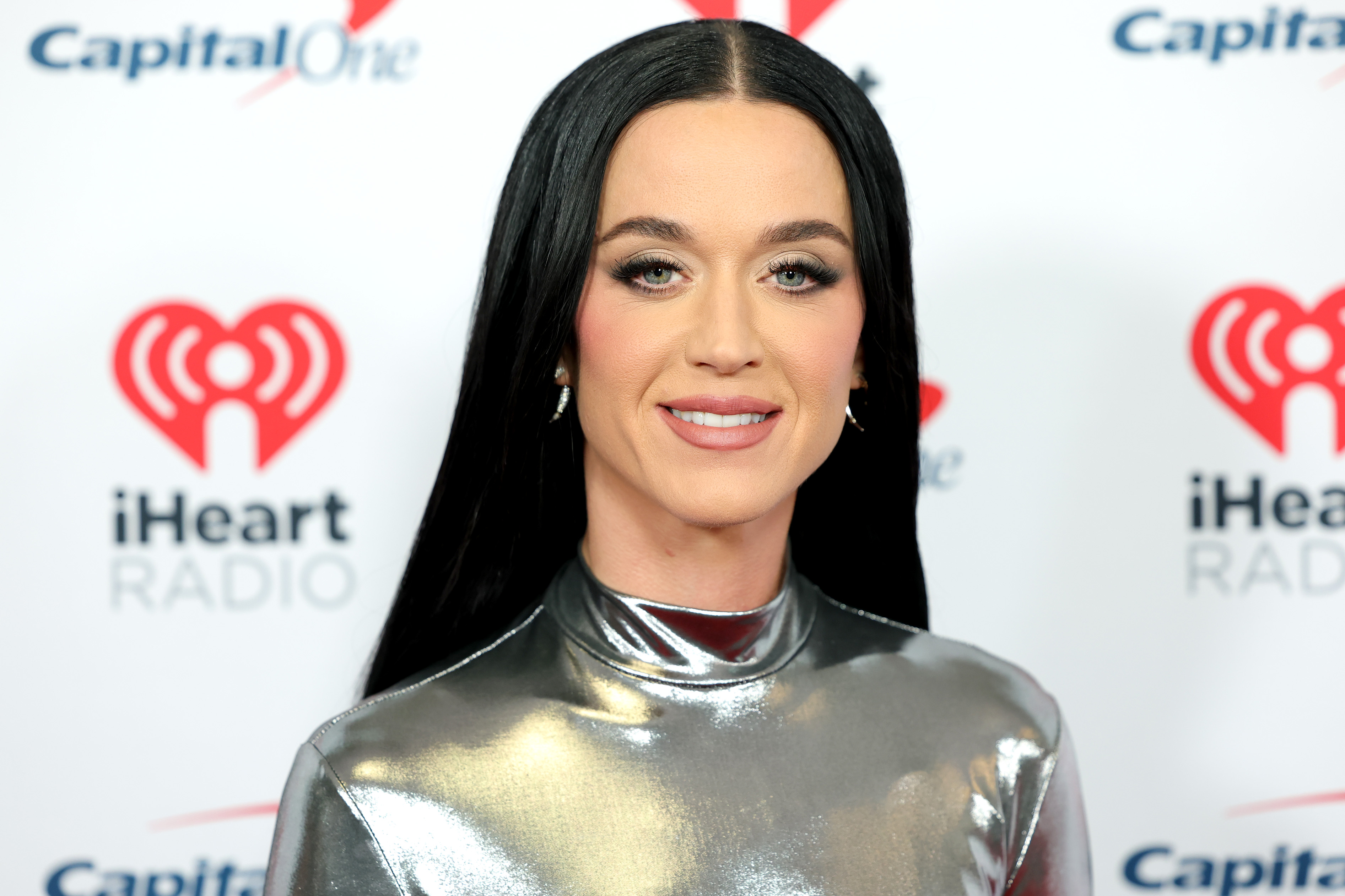 Before her romance with Justin Trudeau became public, Katy Perry was busy with her music career. She wore a shiny silver outfit to iHeartRadio's Jingle Ball in New York City on December 13, 2024. | Source: Getty Images