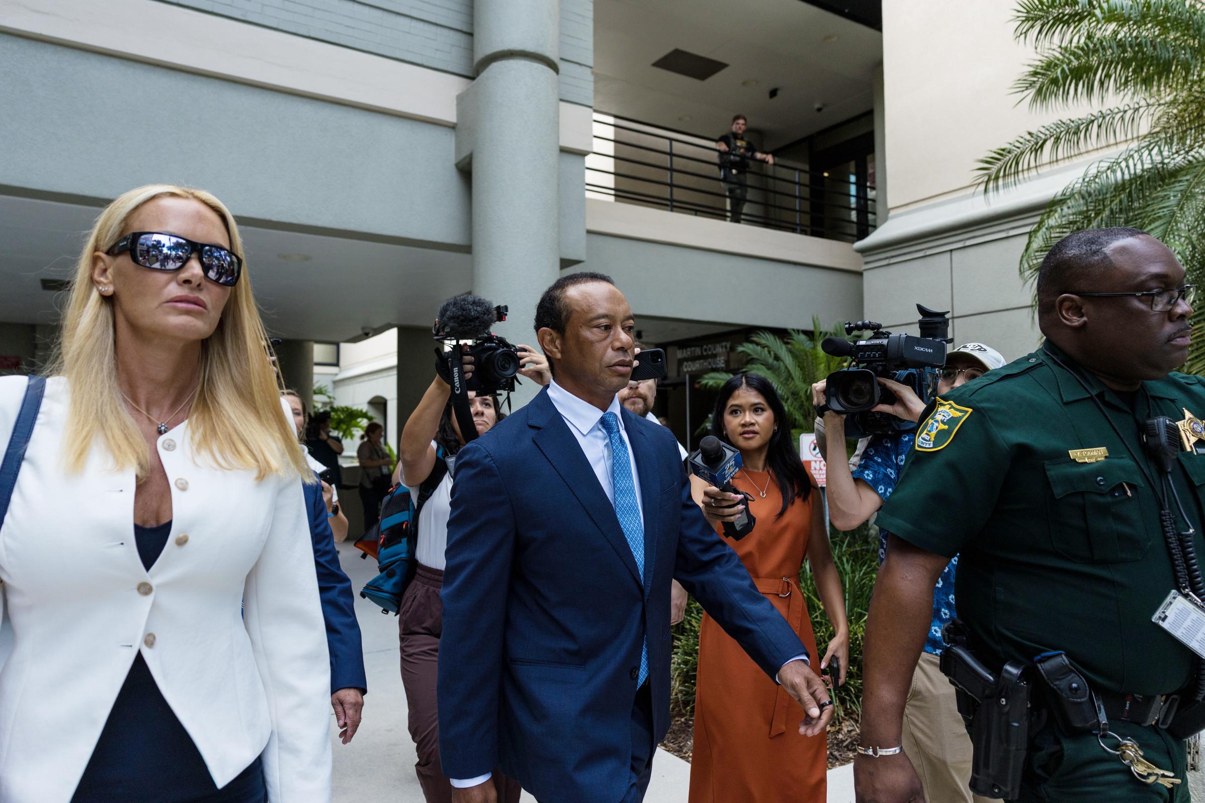 The couple's tense courthouse exit became a visual focal point, with Woods projecting a determined, tightly controlled demeanor as Vanessa Trump walked alongside him without any visible gesture of affection. | Source: Getty Images
