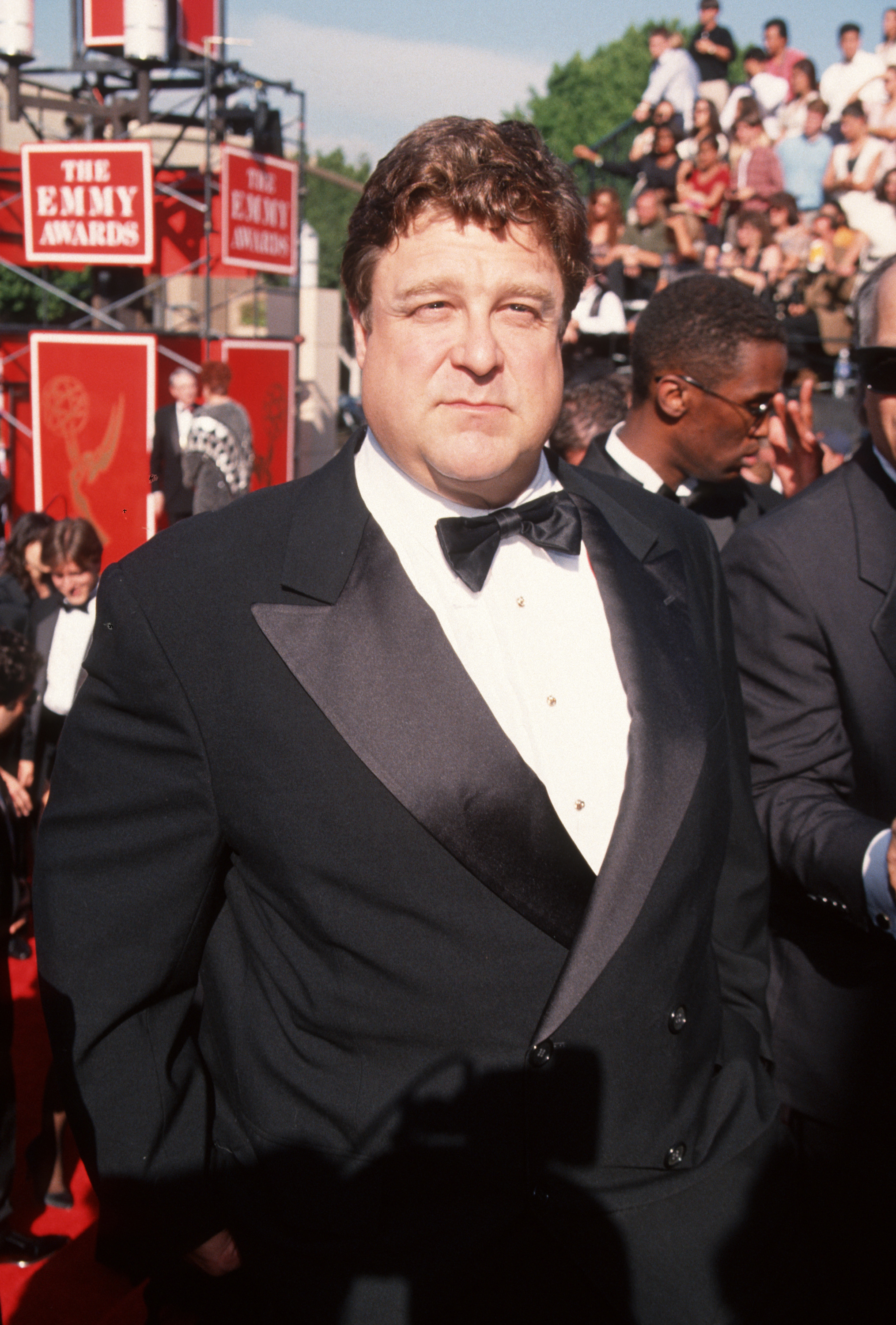 At the 46th Annual Primetime Emmy Awards on September 11, 1994 at Pasadena Civic Auditorium in Pasadena, California, Goodman was photographed in a white shirt tucked into a suit, paired with a bow tie.