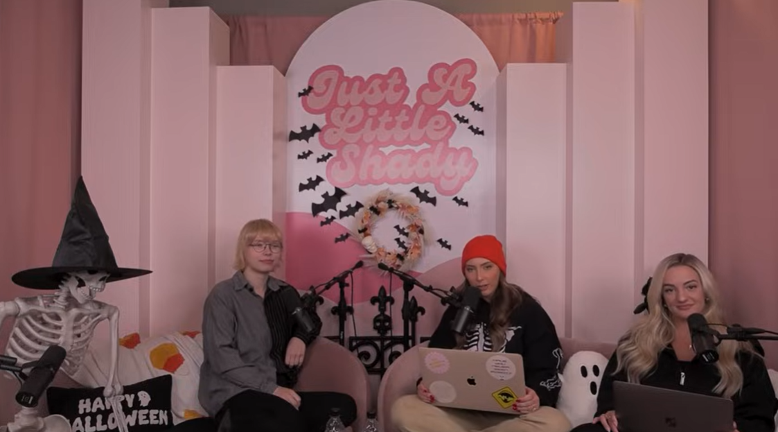 Stevie Laine Scott sits opposite her sister Hailie Jade and co-host Brittany Ednie during a Halloween-themed episode of the podcast Just a Little Shady, posted in November 2023 | Source: YouTube/justalittleshadypodcast