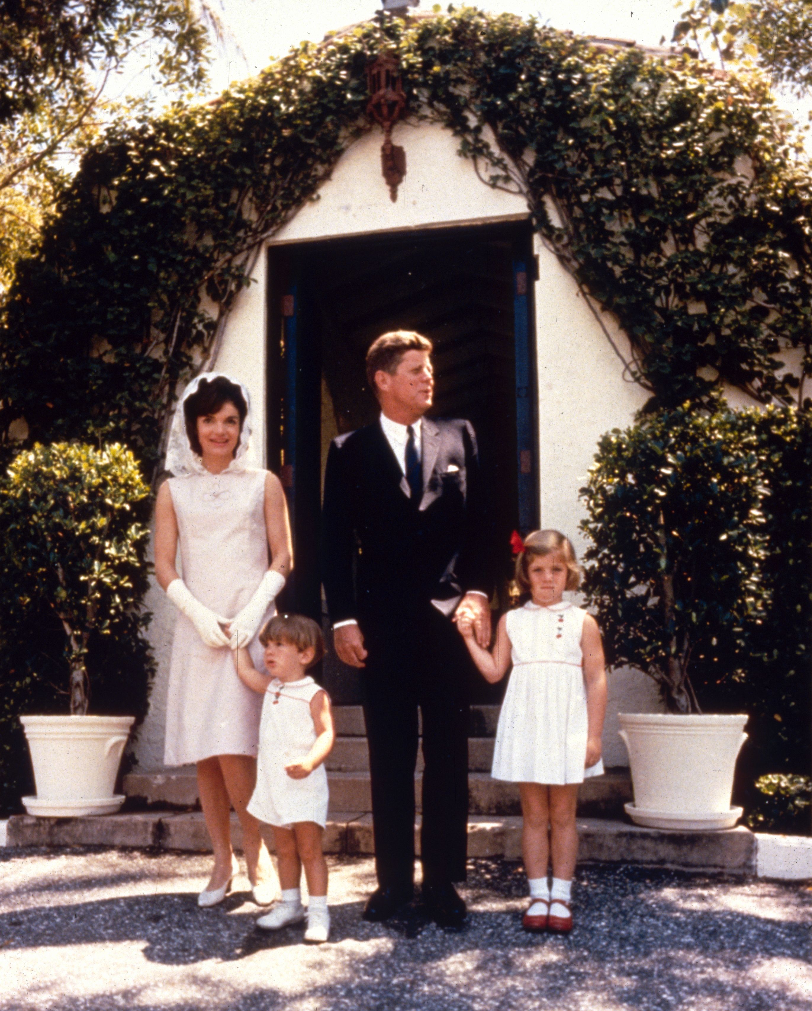 John F. Kennedy and Jacqueline Kennedy Onassis with their children, Caroline and John Jr., in Palm Beach, Miami, Florida, in 1963. | Source: Getty Images