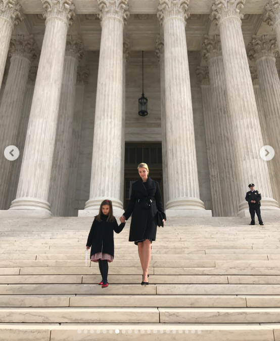 A regal childhood throwback showed Ivanka holding a young Arabella's hand as they descended the sweeping marble steps of the U.S. Supreme Court building in Washington, D.C. Flanked by massive classical columns, both were bundled in coordinated tailored black winter coats. | Source: Instagram/ivankatrump