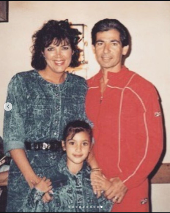 Kris Jenner poses with her then-husband Robert Kardashian and daughter Kim Kardashian in a family portrait, with the three smiling for the camera. | Source: Instagram/krisjenner