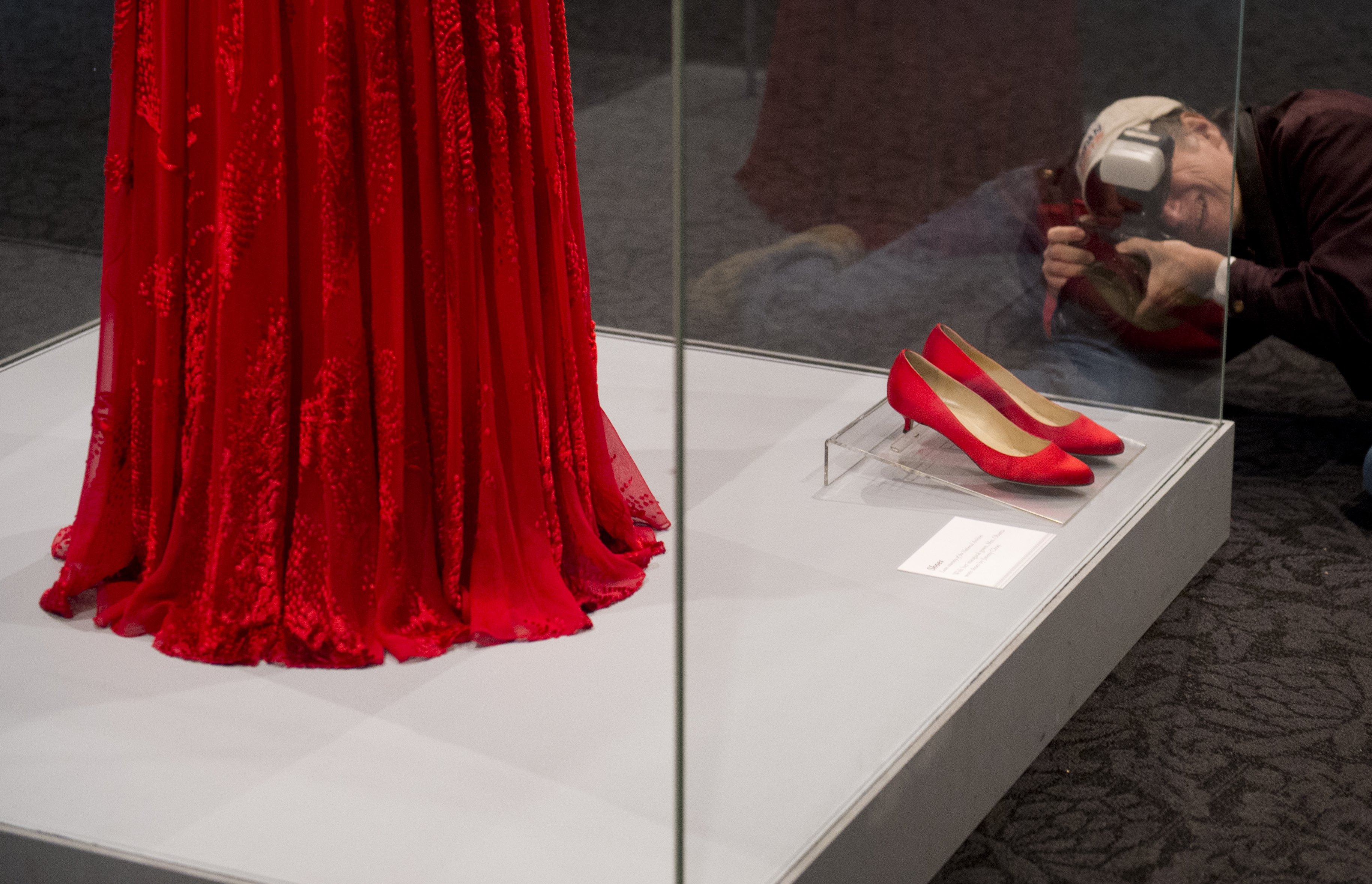 The attention around Michelle’s wardrobe became so intense that some of her most memorable fashion pieces were eventually treated as museum objects. Her ruby Jason Wu gown from Barack Obama’s second inauguration — along with the Jimmy Choo shoes she wore with it — was put on display at the Smithsonian’s National Museum of American History. | Source: Getty Images
