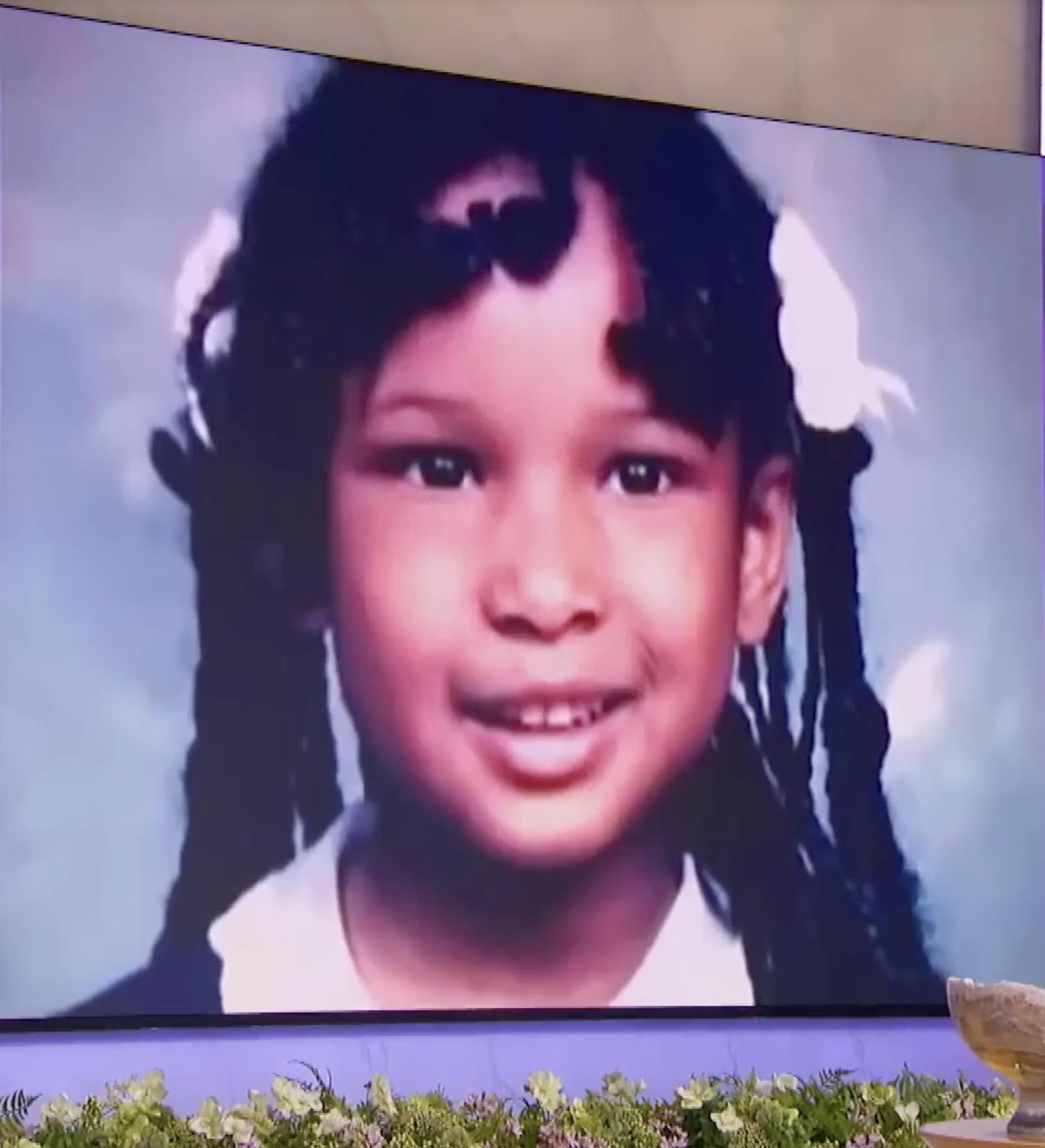 The actress appears in a childhood photo displayed on screen | Source: Youtube/JenniferHudsonShow