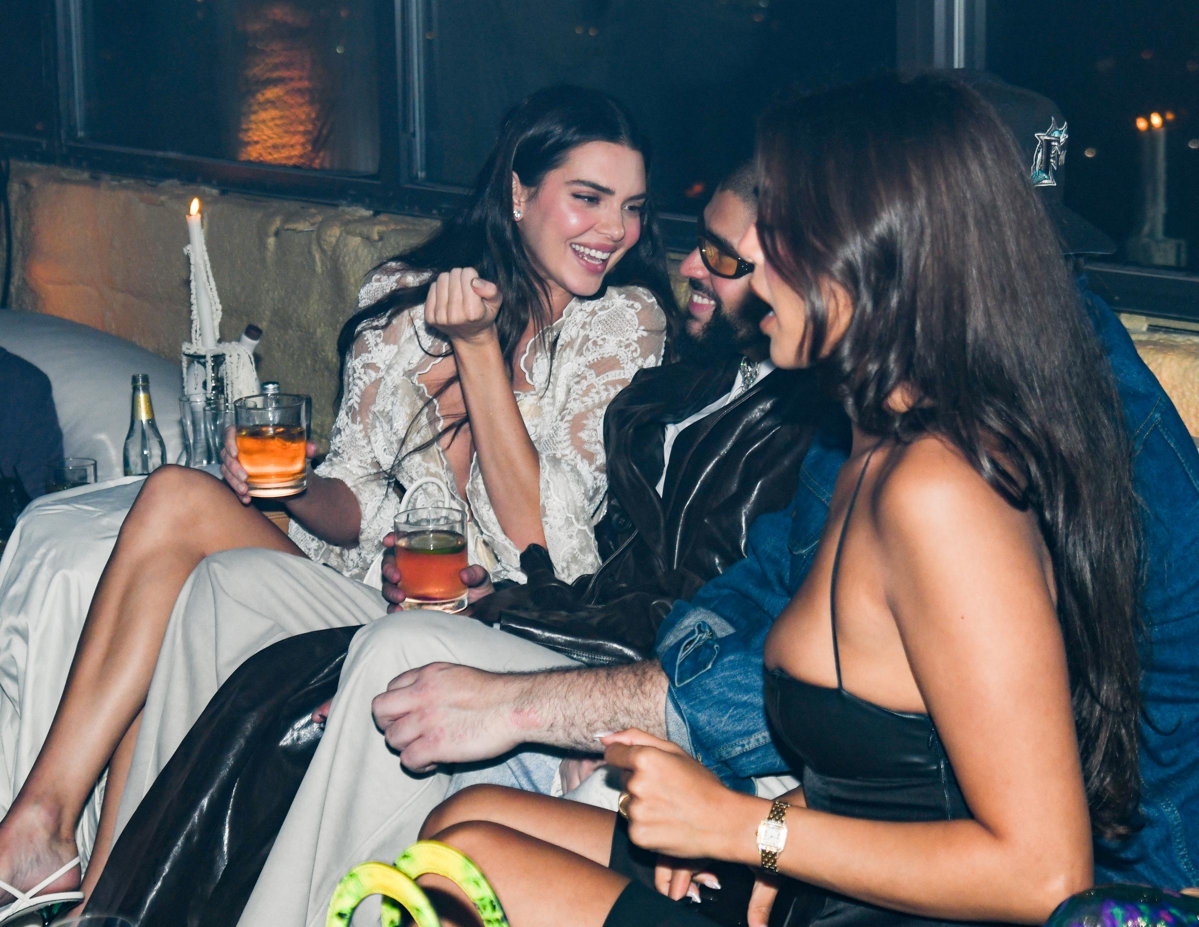 Kendall Jenner and Bad Bunny sharing a moment with other guests at the Après Met 2 Met Gala After Party in New York on May 6, 2024. | Source: Getty Images
