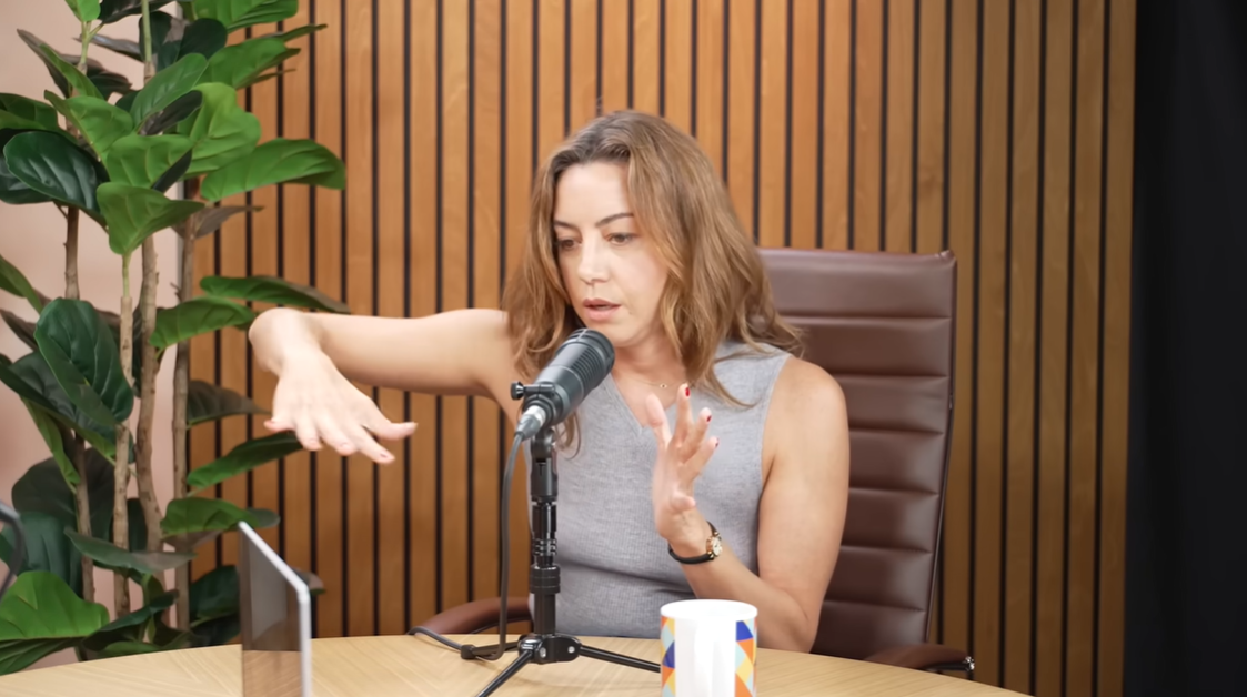 Aubrey Plaza uses her hands to illustrate the metaphor she connected with from a horror film, as posted on August 19, 2025 | Source: YouTube/Good-Hang-with-Amy-Poehler