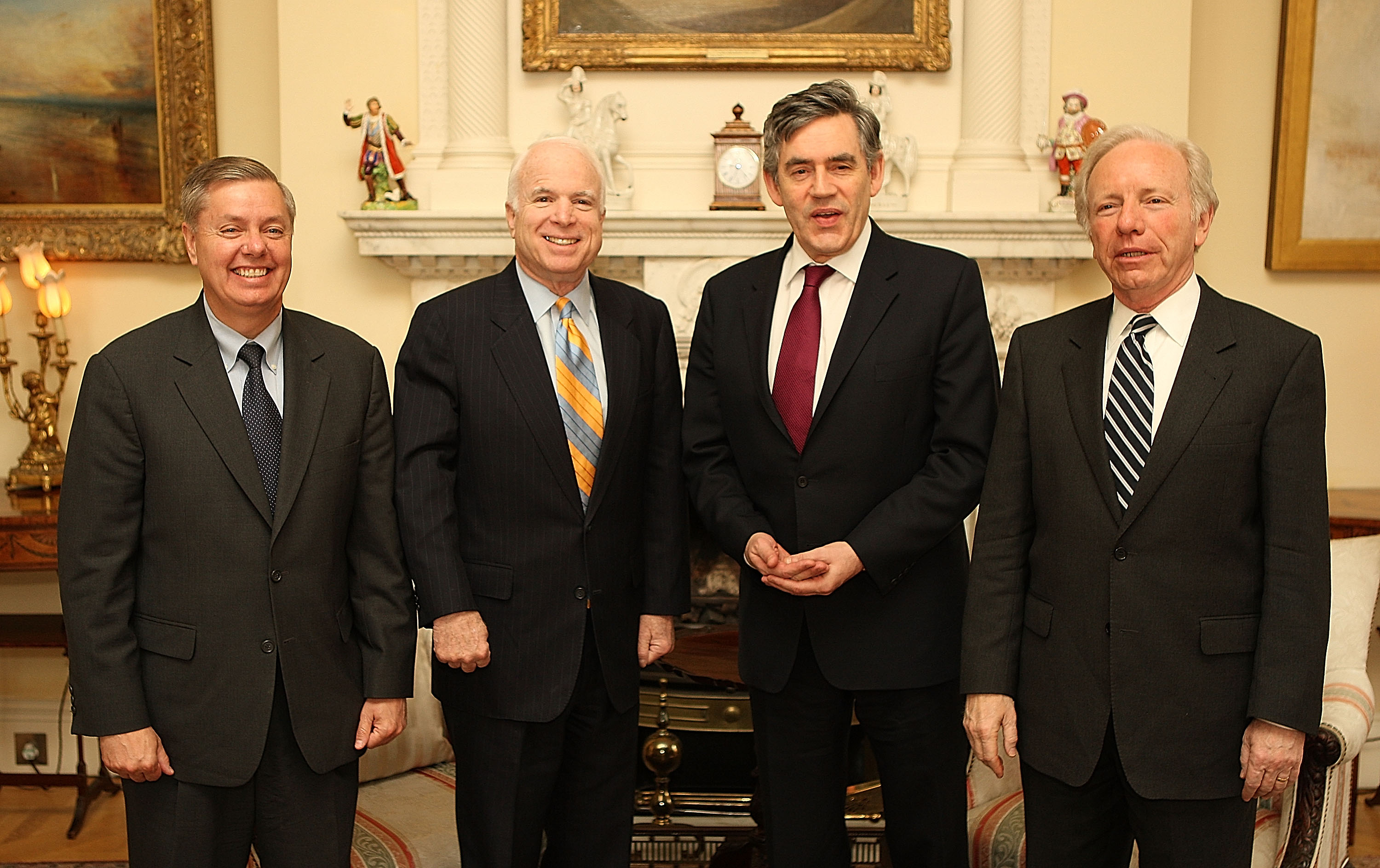 Standing alongside Sen. John McCain, Sen. Joe Lieberman, and British Prime Minister Gordon Brown, Lindsey Graham takes part in high-level discussions abroad. The meeting underscored his growing influence on foreign policy and his frequent involvement in international diplomacy. | Source: Getty Images