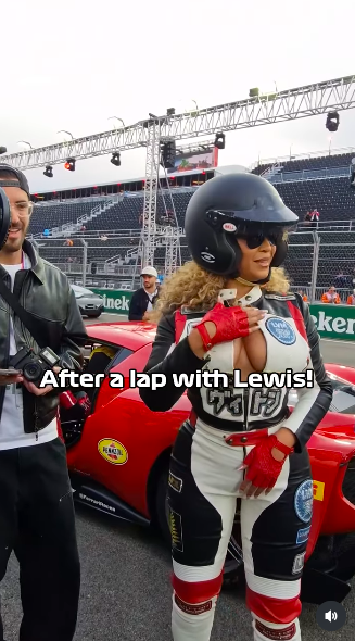 Beyoncé Knowles-Carter patting her chest after she and Lewis Hamilton went for a lap around the course, posted on November 23, 2025. | Source: Instagram/f1