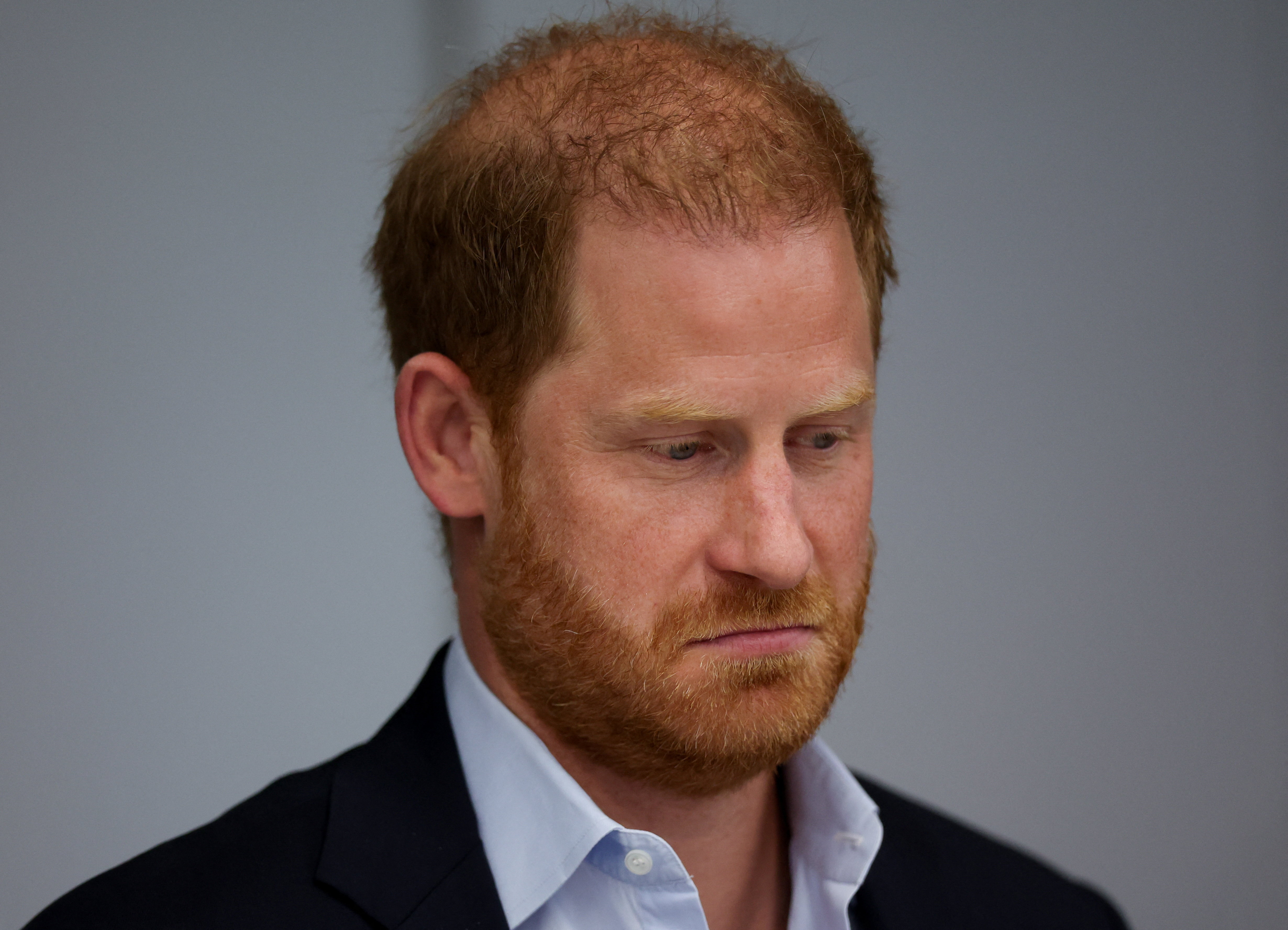 Prince Harry speaks with staff during a London engagement in September 2025. His solo appearances in the U.K. continued well before the Sussexes' plans to establish a family base there became public. | Source: Getty Images