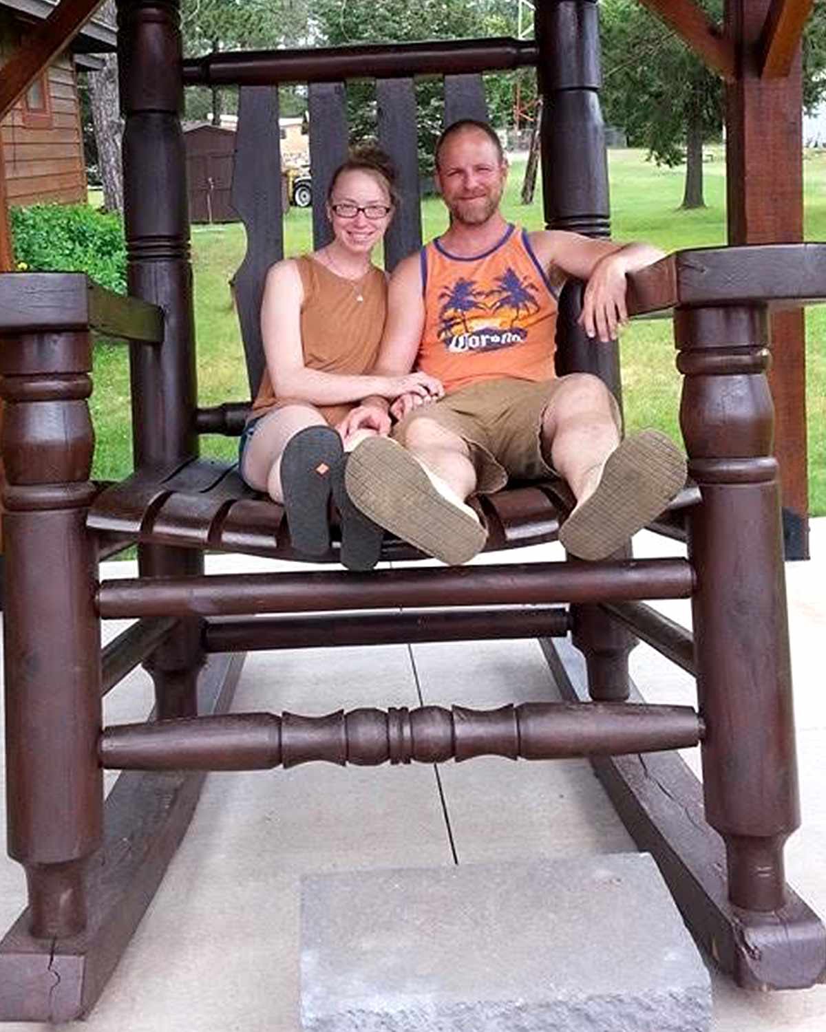 Nicole Heiser is pictured with a companion on an oversized wooden rocking chair in a personal photograph, offering a glimpse of her life outside the veterinary clinic. | Source: Nicole Heiser / Facebook.