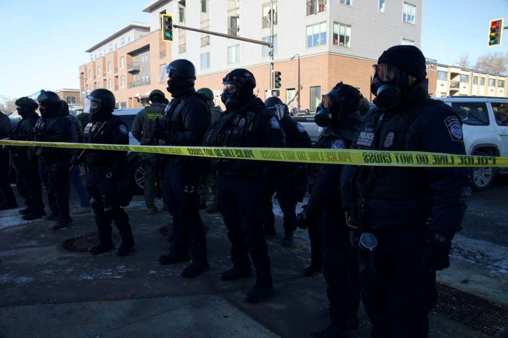 Law enforcement officers secure the scene at 26th Street West and Nicollet Avenue after Alex Pretti was shot by a federal agent in Minneapolis, Minnesota on January 24, 2026. | Source : Getty Images
