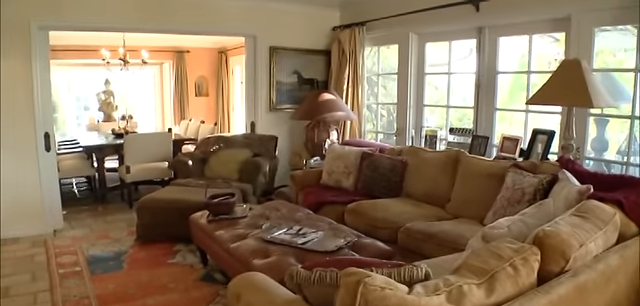 The open floor plan provides a clear view from the cozy living room directly into the formal dining area. | Source: YouTube/@Biography