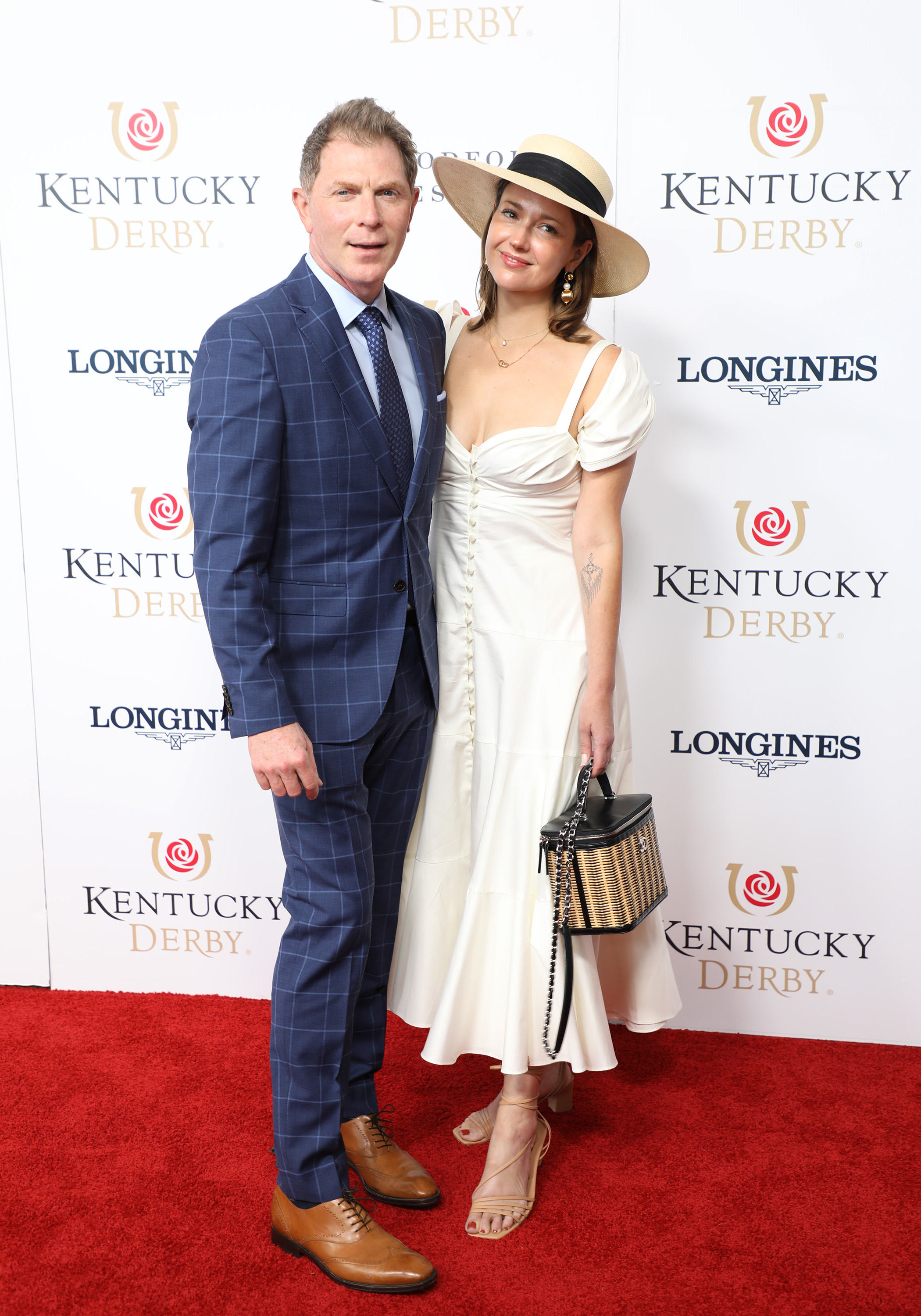 Bobby Flay and Christina Perez at the 148th Kentucky Derby on May 07, 2022, at Churchill Downs in Louisville, KY | Source: Getty Images