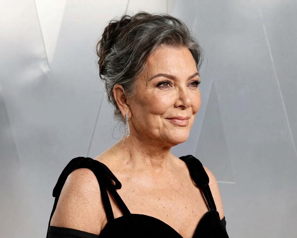 With her hair swept into an elegant updo, this imagined Kris embraces gray strands, natural facial lines and a softer, more mature appearance. | Source: Gemini