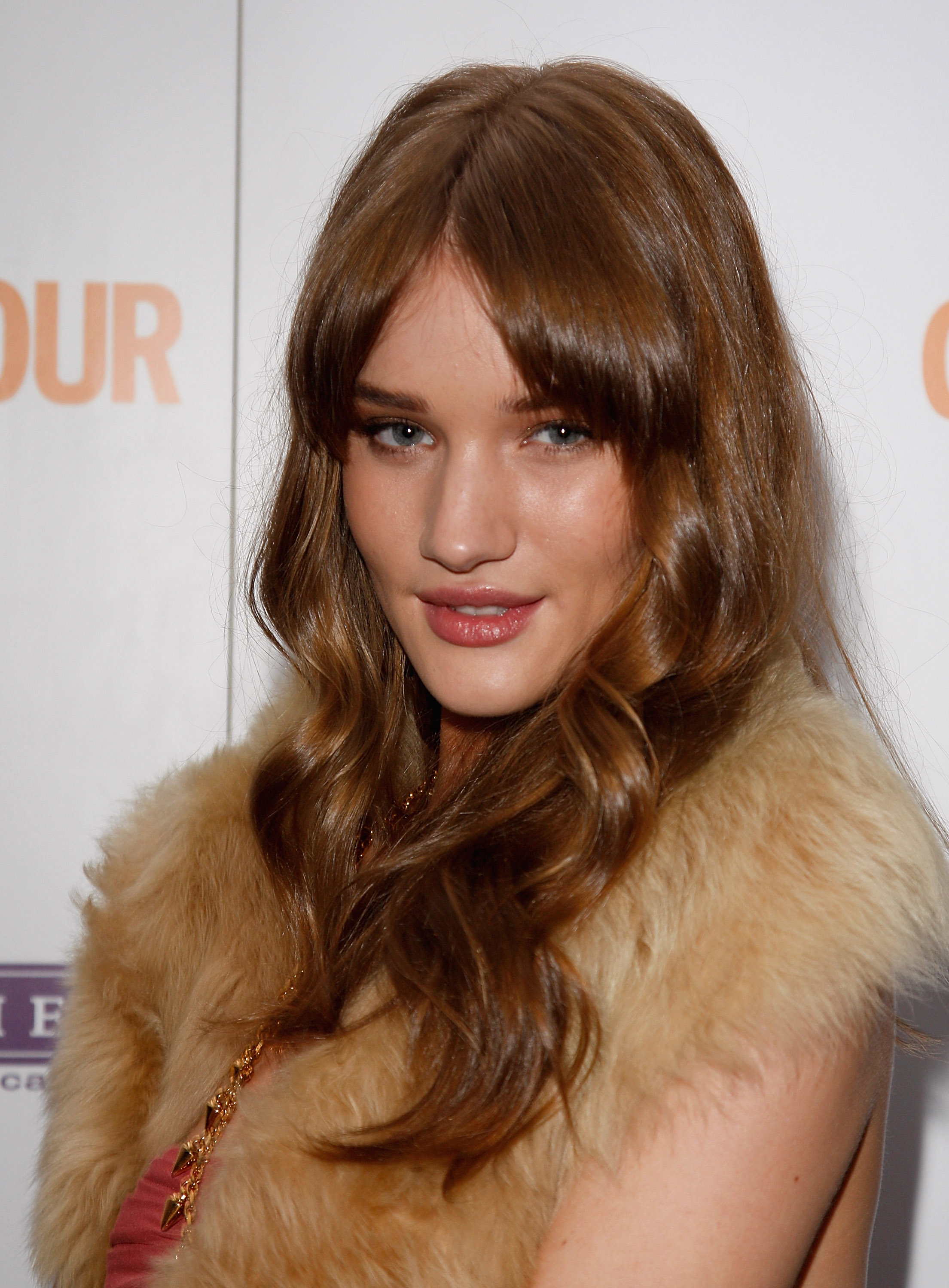 Rosie Huntington-Whiteley turns up the heat in soft brunette hair and a luxe fur at the Glamour Women Of The Year Awards. | Source: Getty Images