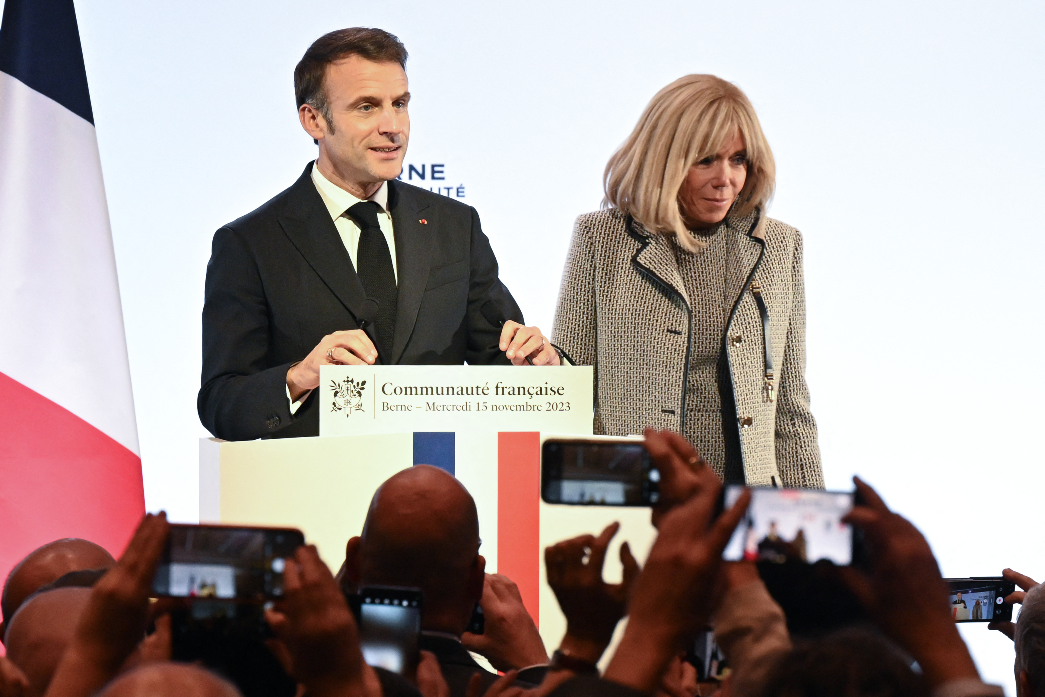 Brigitte Macron standing beside Emmanuel Macron as he delivers a speech to the French community in Bern on November 15, 2023. | Source: Getty Images