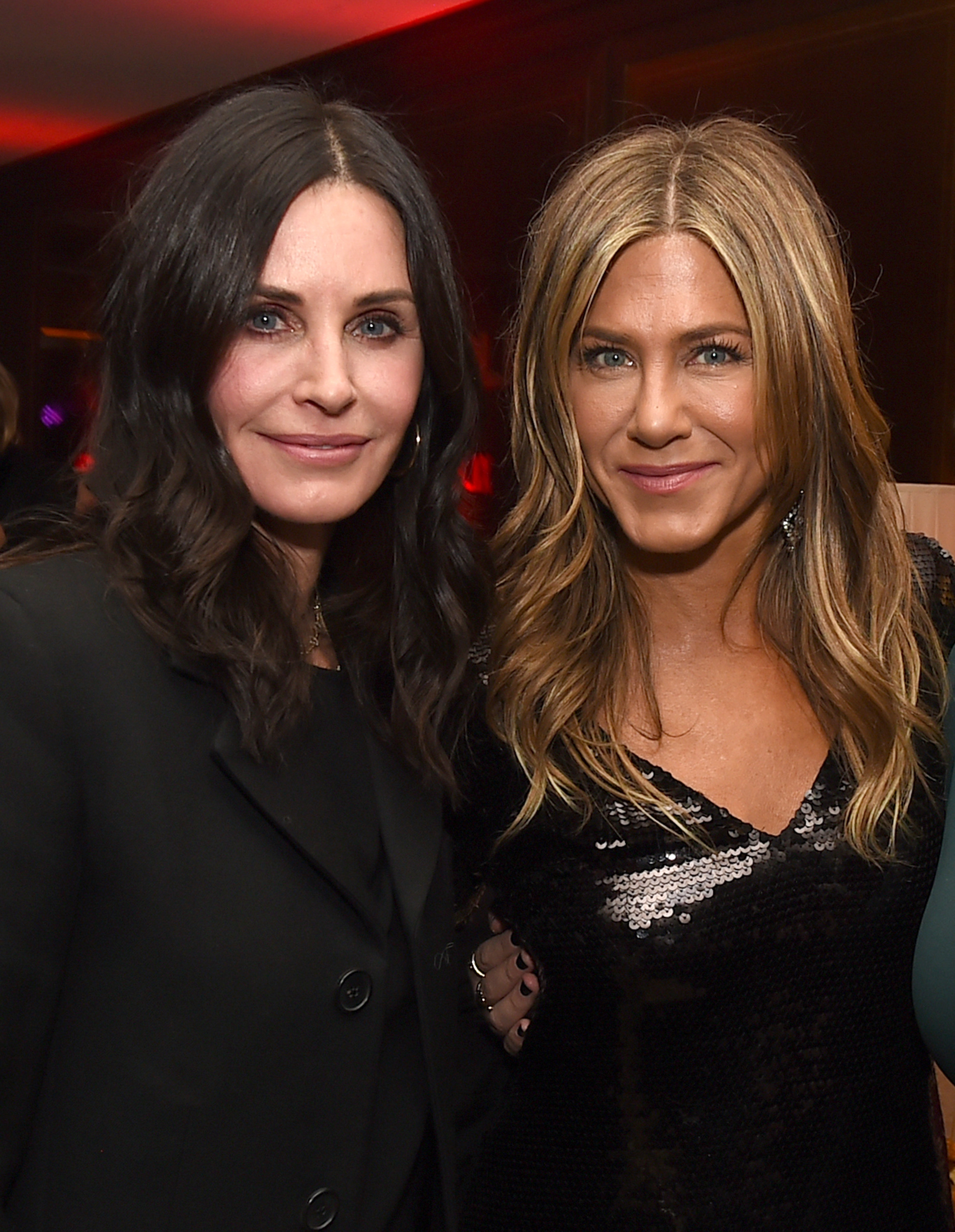 Courteney Cox and Jennifer Aniston pose at the after-party for the premiere of Netflix's "Dumplin’" at Sunset Tower in Los Angeles, California. Their faces show subtle lines of time, yet their eyes still share the same striking color and glow.