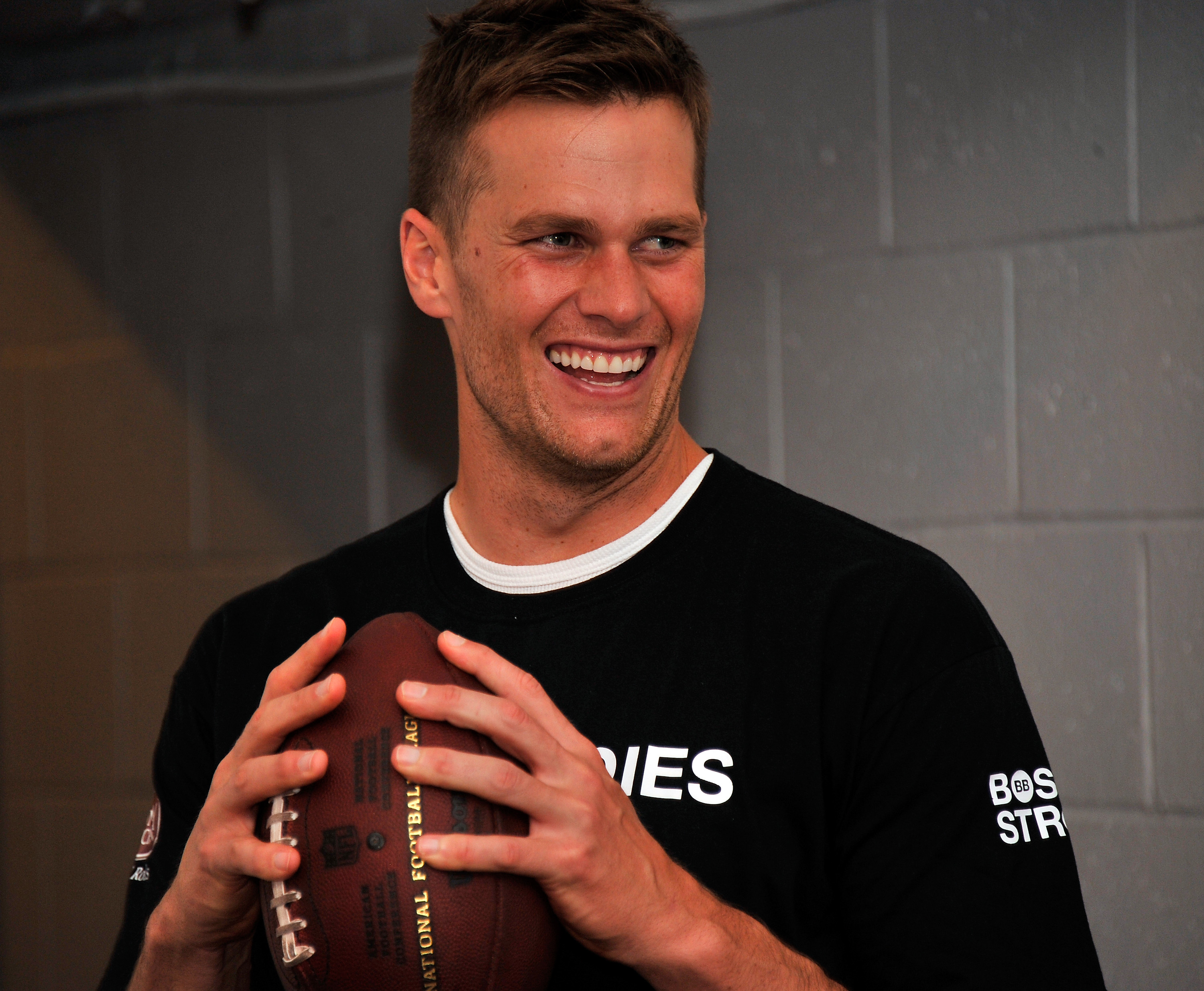 Brady smiled while attending the Best Buddies Challenge in Boston in 2013, appearing relaxed during the charity football event.
