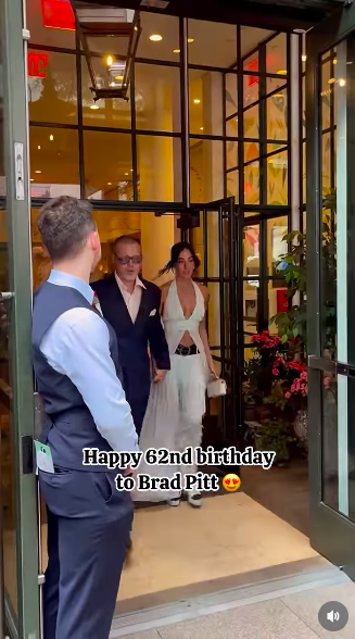 Brad Pitt and Ines de Ramon walking out to the presence of paparazzi and onlookers gathered outside. | Source: Instagram/girlfromjerseycity