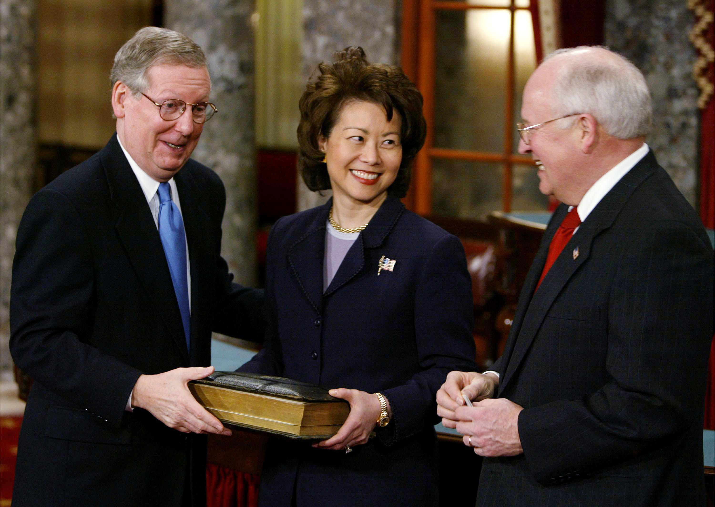 Former US Vice President Dick Cheney standing alongside Elaine Chao and Mitch McConnell during a swearing in re-enactment in Washington, DC on January 7, 2003. | Source: Getty Images