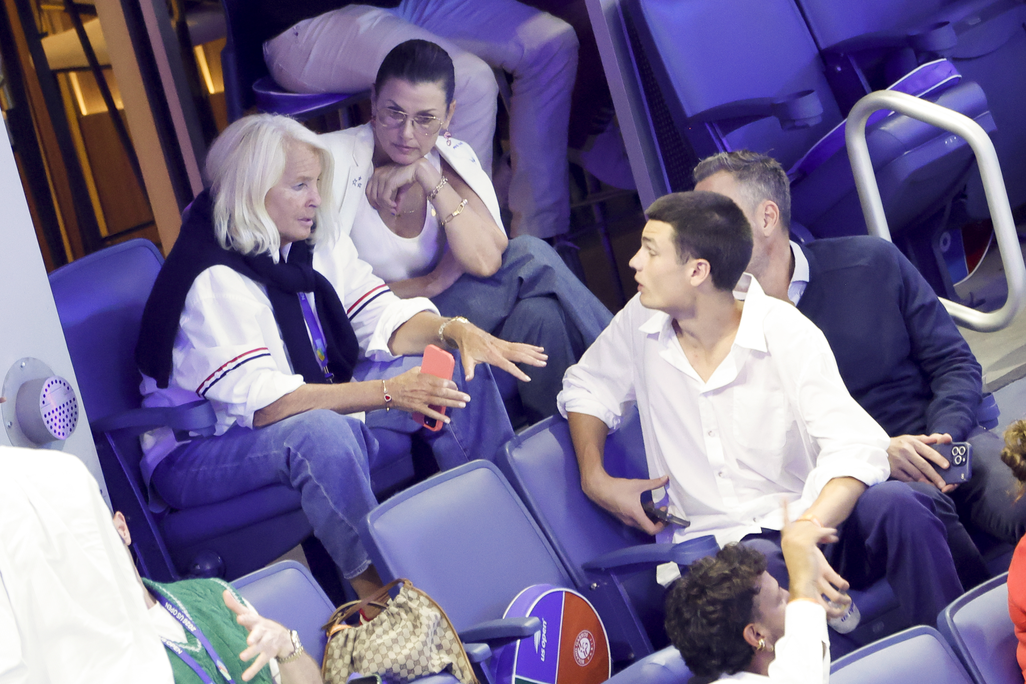 Bridget Moynahan and her son Jack sit together during the 2026 US Open on August 30, 2026, as they chat with fellow spectators in the stands. | Source: Getty Images