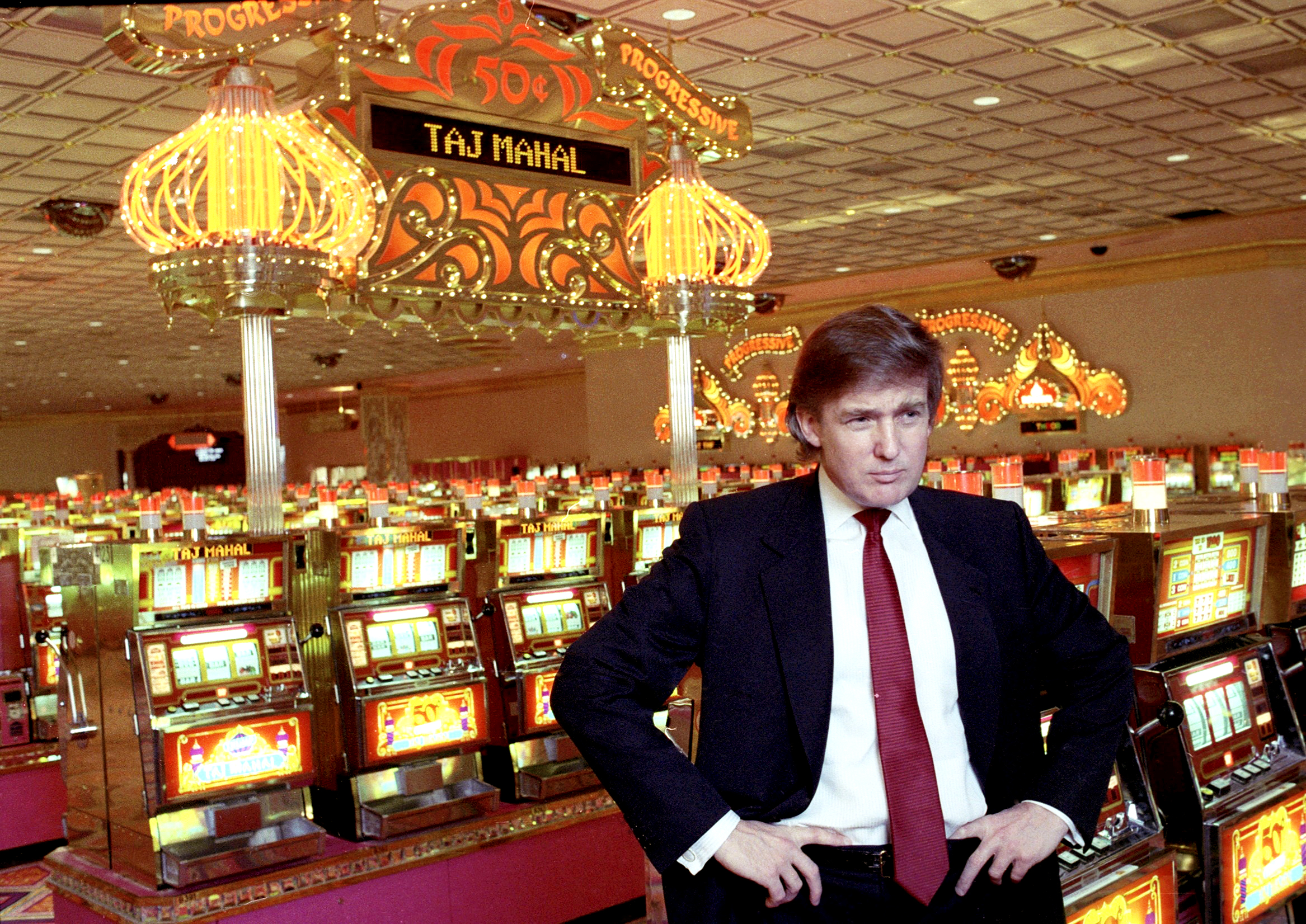Donald Trump shows off his still-dark, neatly swept hairstyle inside the Trump Taj Mahal casino in Atlantic City, New Jersey, on March 16, 1990.