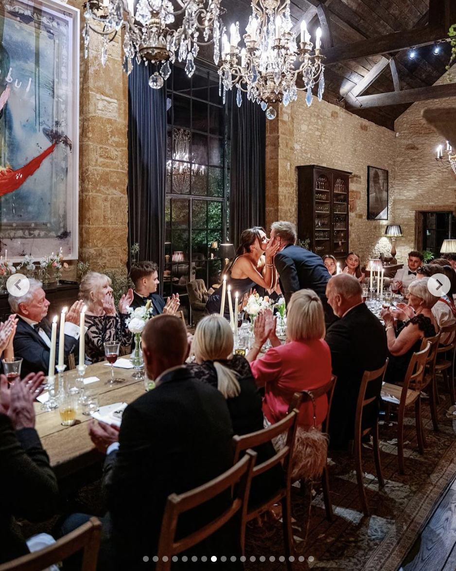 Victoria and David Beckham share a kiss during his 50th birthday celebration dinner, as seen in a photo dated May 4, 2025 | Source: Instagram/victoriabeckham