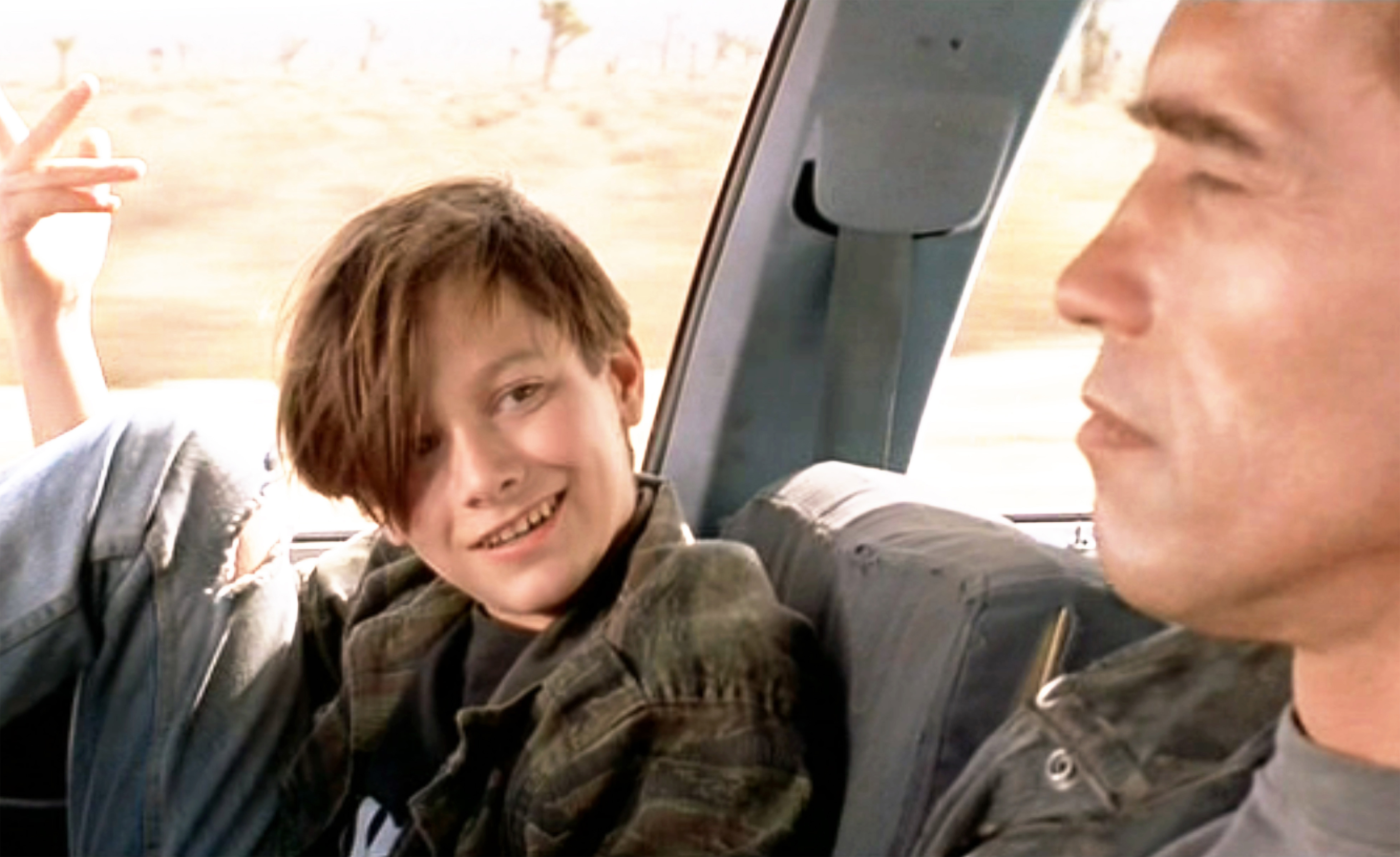 Edward Furlong (as John Connor) and Arnold Schwarzenegger (as the T-800 Terminator) on July 3, 1991 | Source: Getty Images