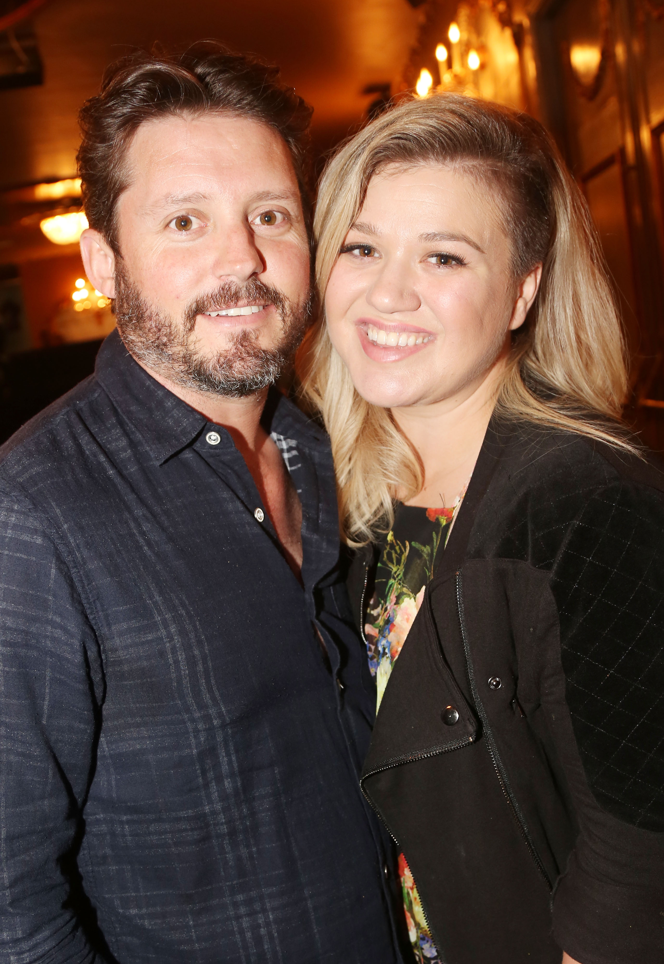 Brandon Blackstock and Kelly Clarkson pose backstage at the hit musical "Finding Neverland" on Broadway at The Lunt Fontanne Theater on July 15, 2015 in New York City | Source: Getty Images