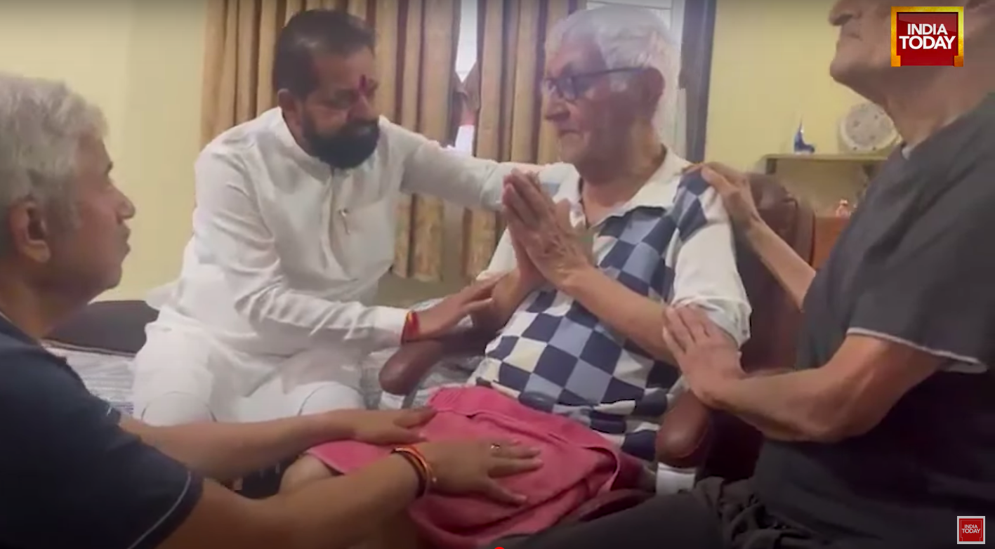 MLA Dilip Mama Lande and others comforting Captain Sumeet Sabharwal's father. | Source: YouTube/India Today