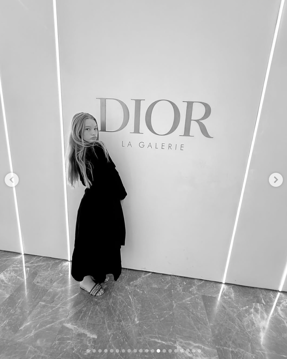 Maxwell Drew Johnson poses in front of the Dior sign, as seen in a photo shared on May 12, 2025 | Source: Instagram/jessicasimpson