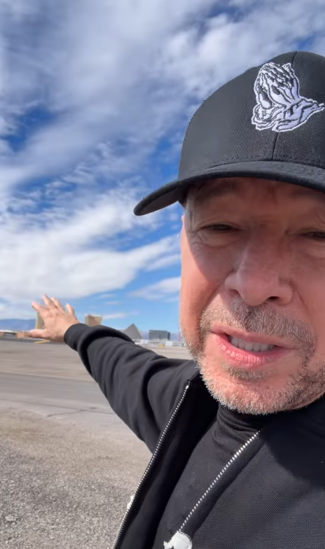 Donnie Wahlberg gestures toward the airport grounds while recounting the path his private jet took during the runway overrun. In his Instagram video, the actor described fences and other obstacles that he said the aircraft avoided before coming to a stop. | Source: Instagram/donniewahlberg