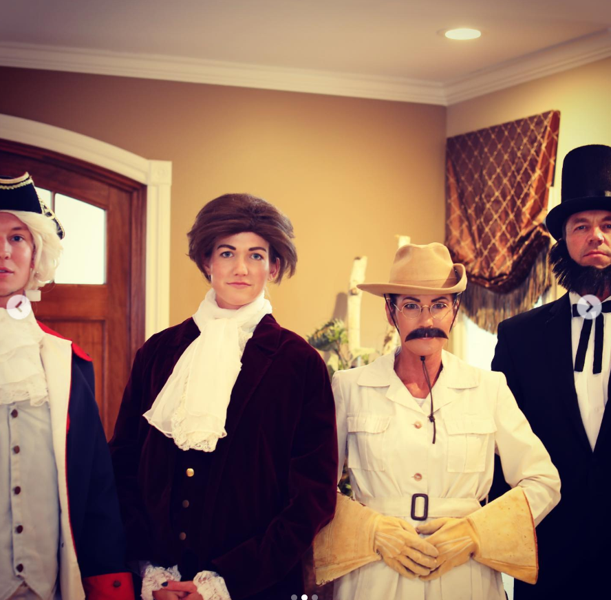 In a playful lineup of period costumes, Bryon Noem reprises his Lincoln look while Kristi Noem, in a safari-inspired outfit with a curled mustache, adds a theatrical, tongue-in-cheek charm to the scene. | Source: Instagram/sdbryonnoem