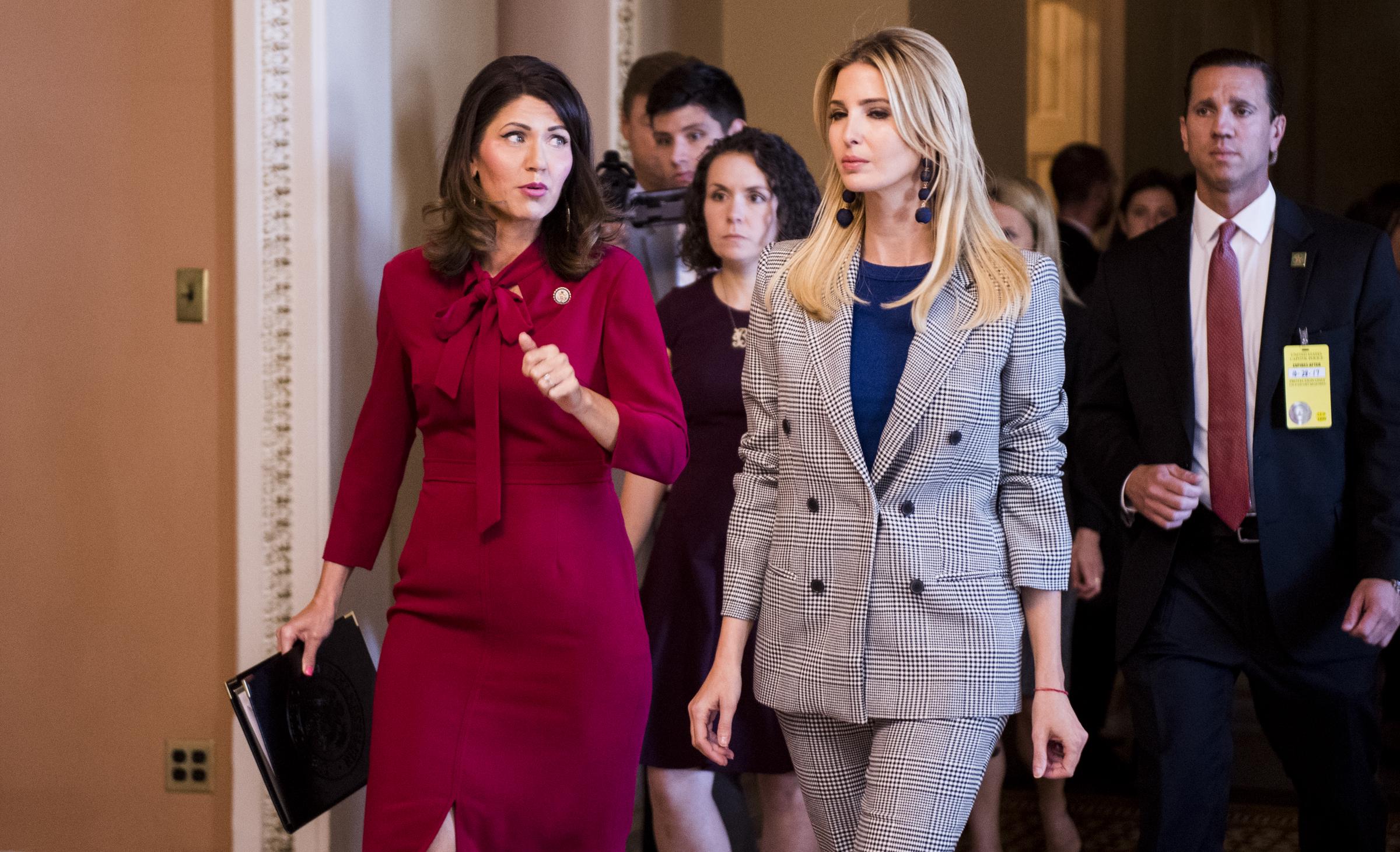 Kristi Noem and Ivanka Trump speak as they walk through the Capitol en route to a press conference on child tax credits on October 25, 2017, in Washington, D.C. | Source: Getty Images