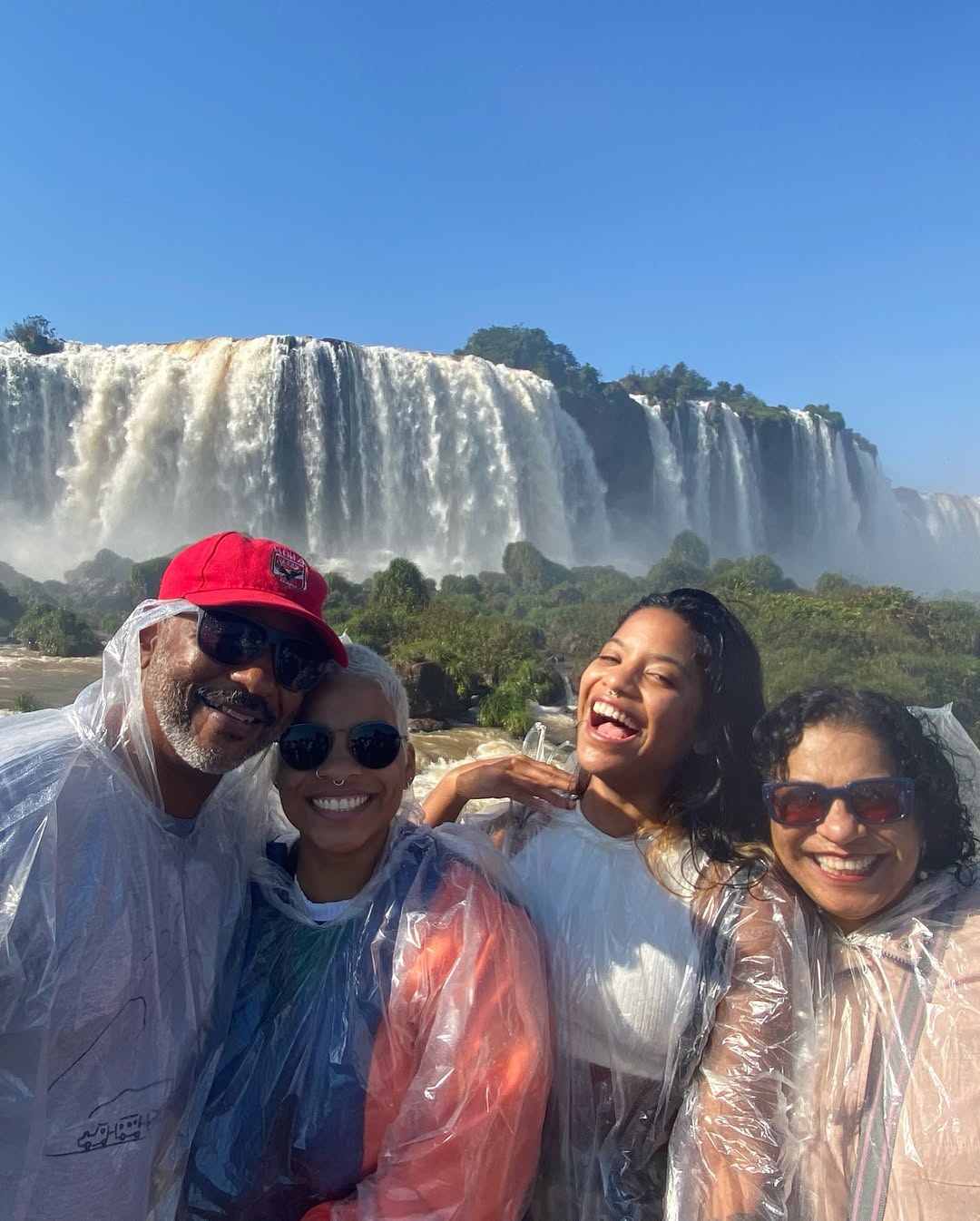 Juliana Marins and her family in front of a waterfall, from a post dated May 27, 2025 | Source: Instagram/ajulianamarins