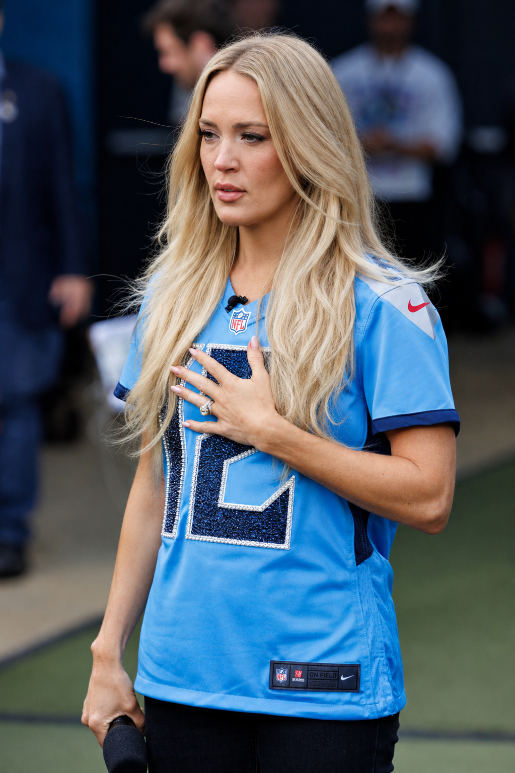 AI-rendered portrait envisioning Carrie Underwood with long blonde hair, subtle makeup, and softly defined facial features. | Source: ChatGPT