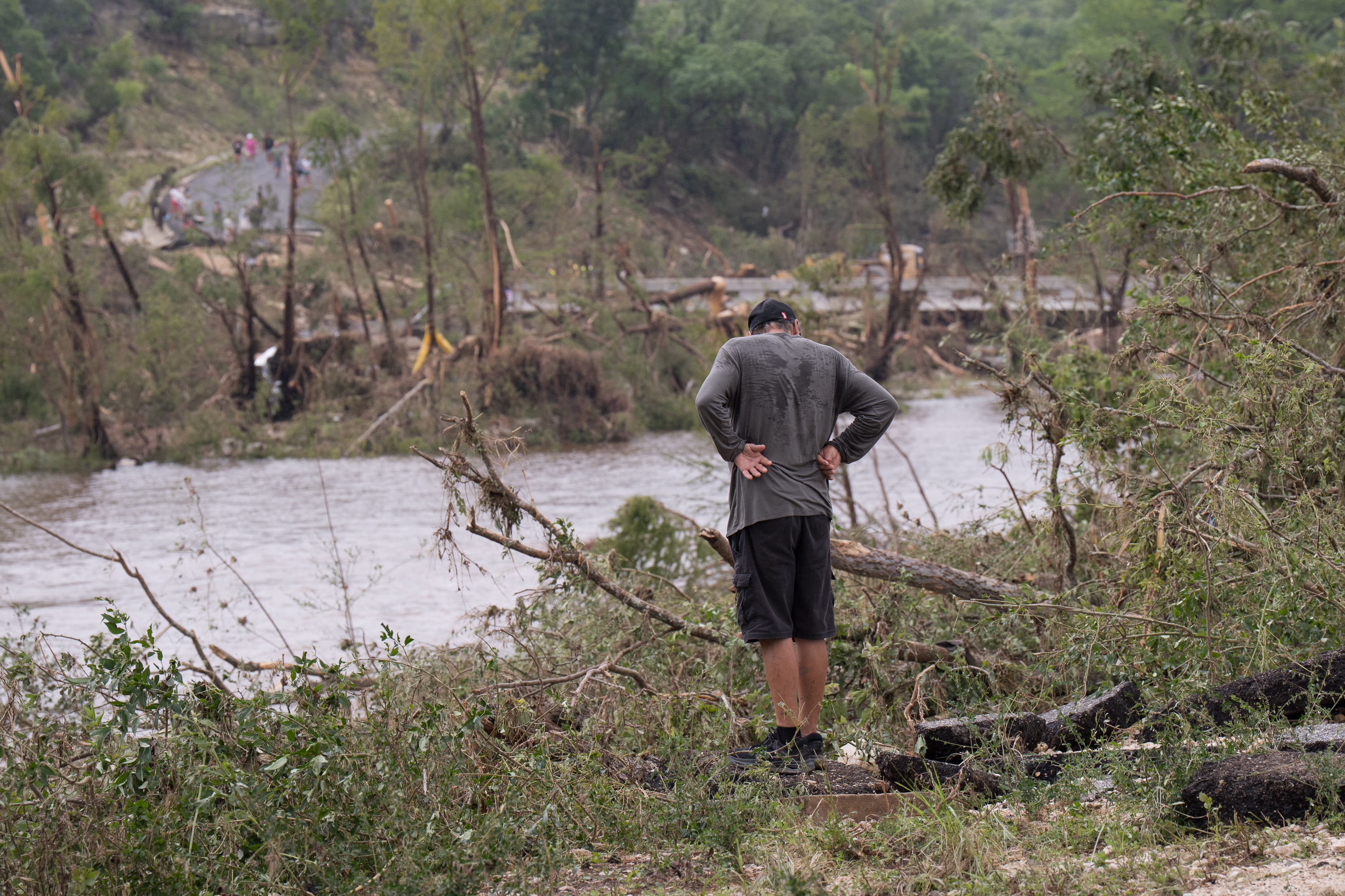 Kerrville resident observes flood damage along the Guadalupe River near Ingram Warrior Stadium in Kerr County, Texas on July 5, 2025. | Source: Getty Images