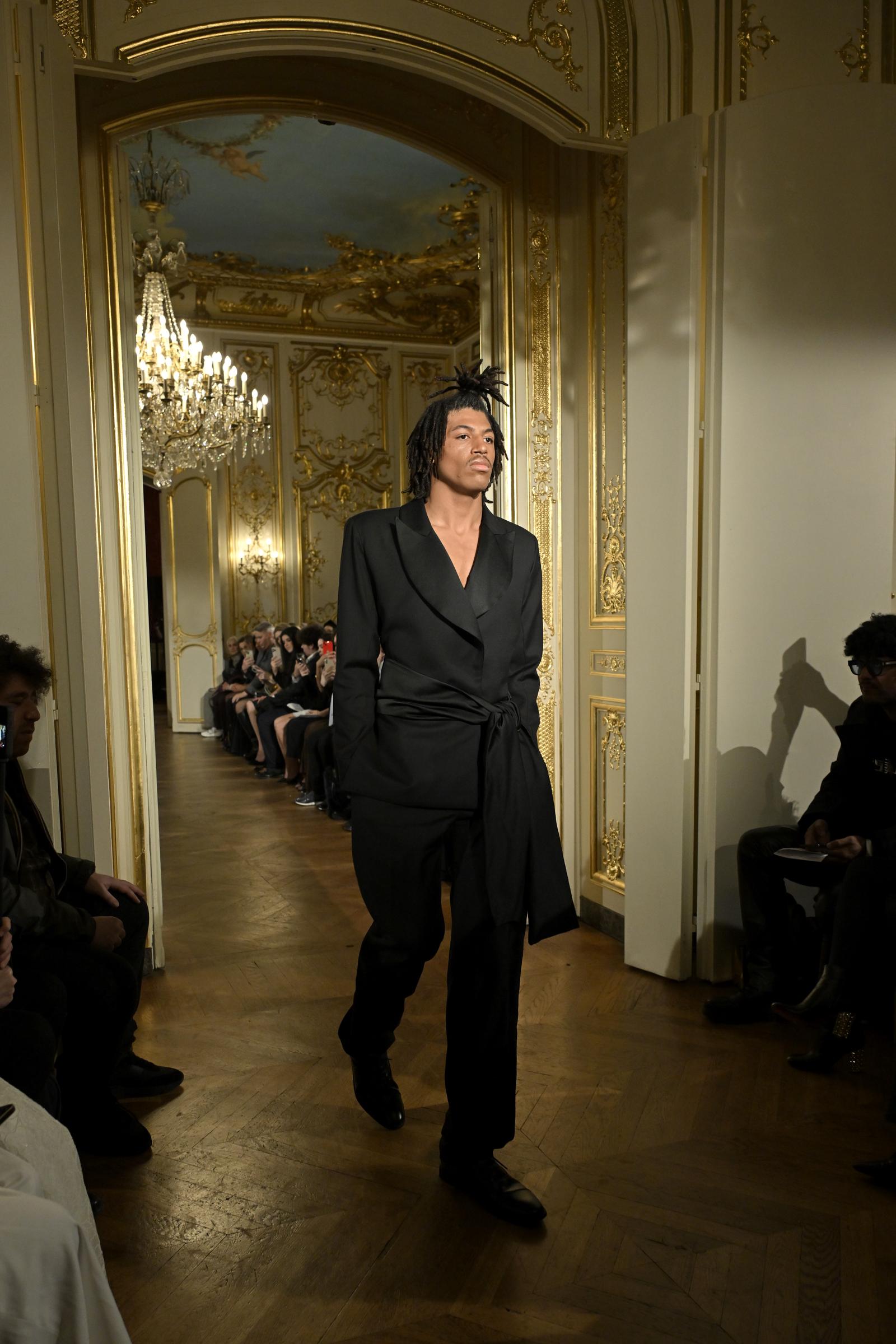 Henry Günther Ademola Dashtu Samuel walks the runway during the Lena Erziak Haute Couture Spring-Summer show as part of Paris Fashion Week at Hotel Le Marois on January 28, 2025, in Paris, France | Source: Getty Images